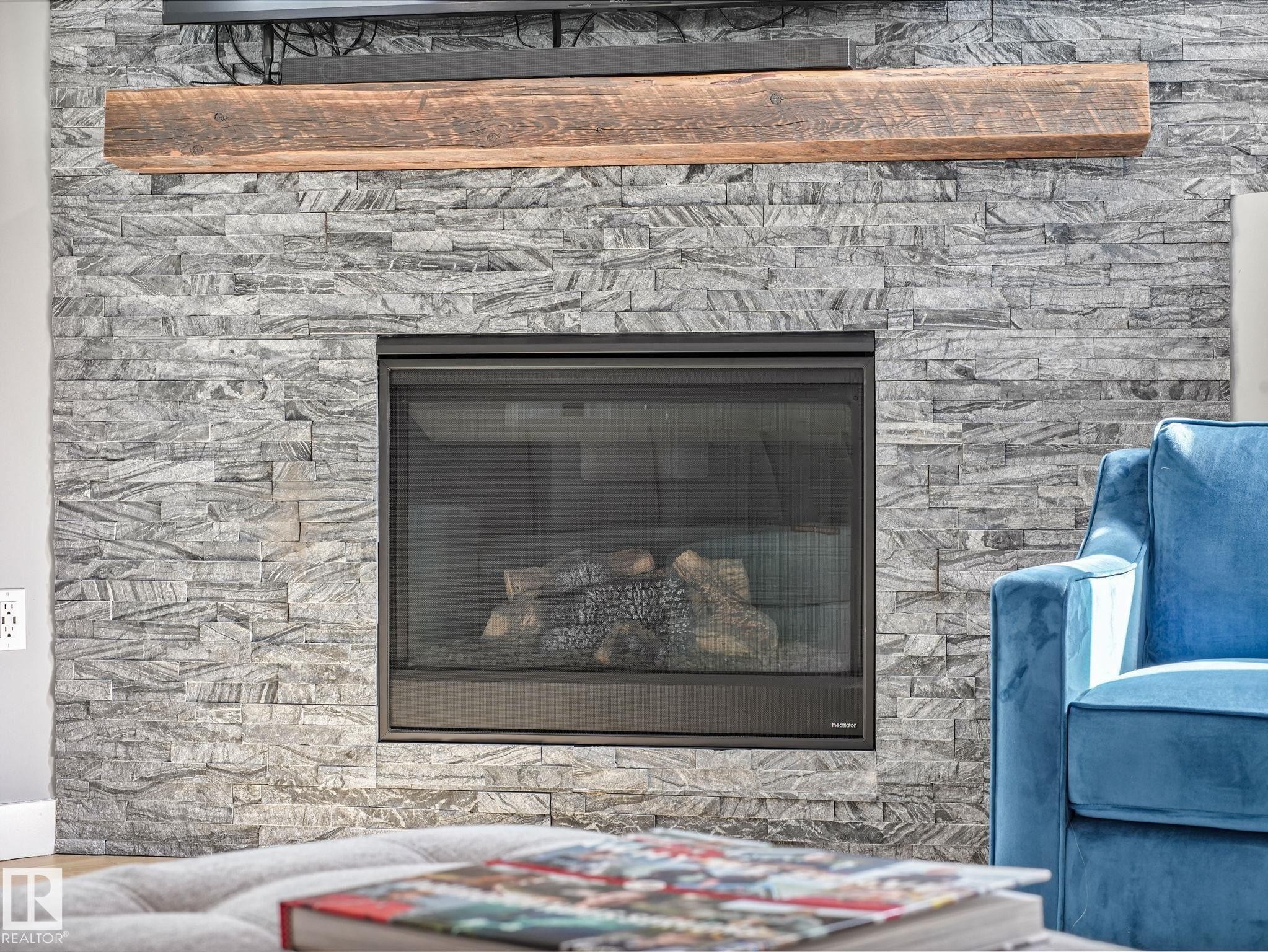 4115 58 Street, Beaumont, AB - Indoor Photo Showing Living Room With Fireplace