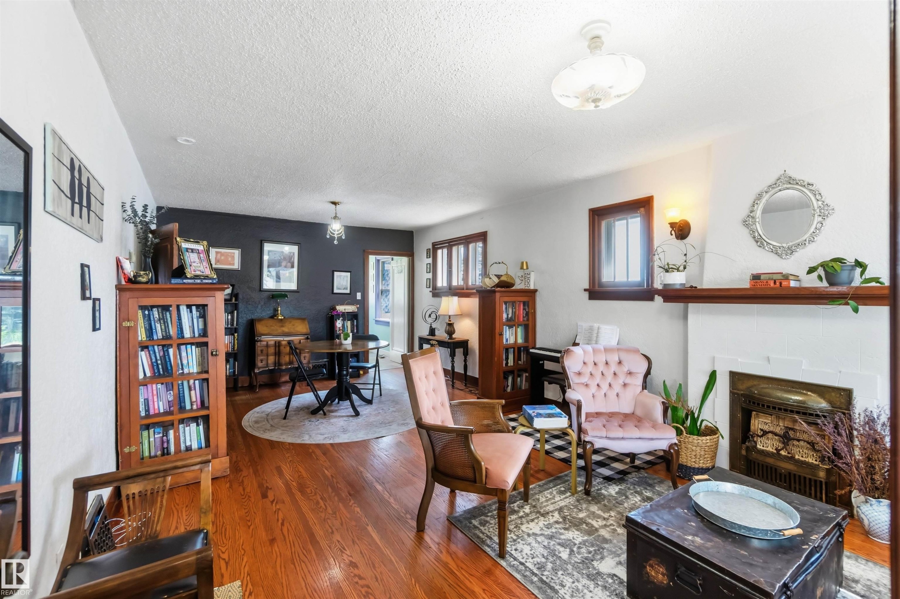 11343 96 Street Nw, Edmonton, AB - Indoor Photo Showing Living Room With Fireplace