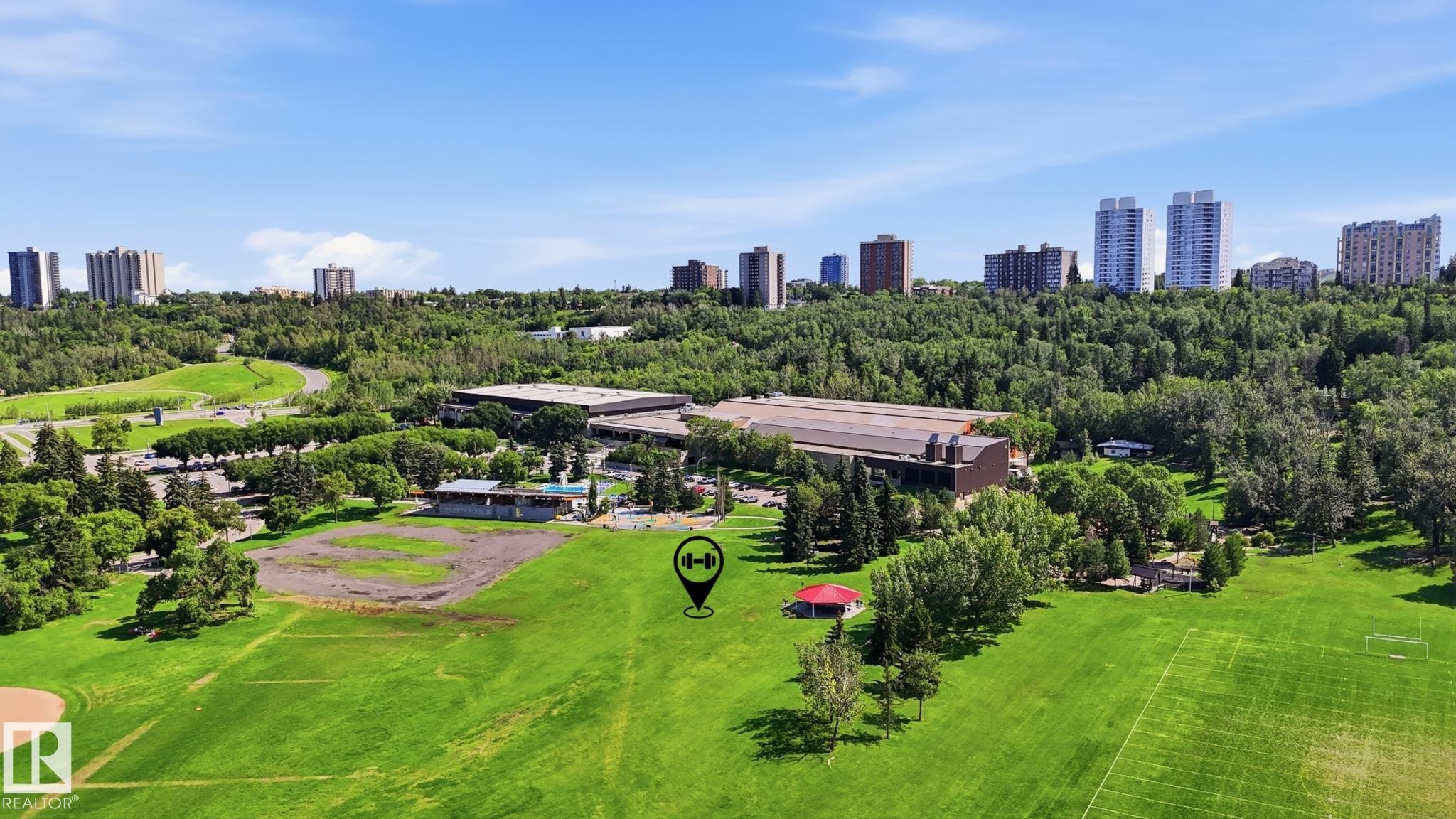 Expansive green space featuring large grass fields and mature trees - #1508 10883 Saskatchewan Dr Nw Nw, Edmonton, AB - Outdoor With View