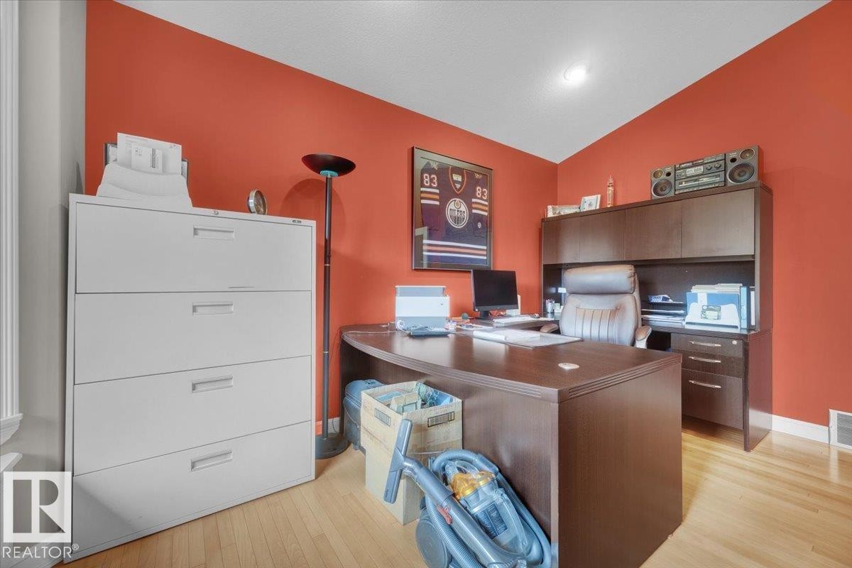 Dedicated room featuring wood-finish flooring, a vibrant wall color, and white trim - 928 Thompson Place Nw, Edmonton, AB - Indoor Photo Showing Office