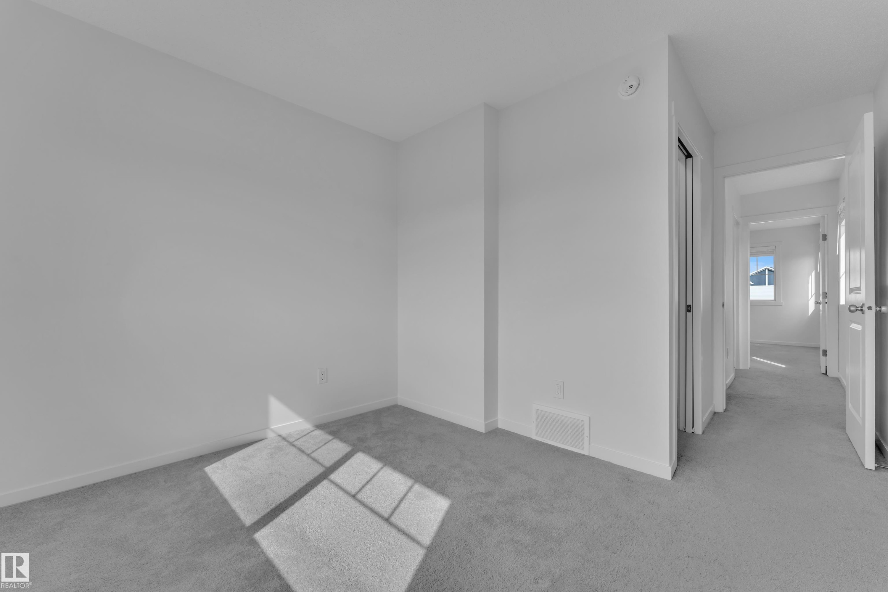 Room featuring light gray carpeting, white walls, and white trim - #64 17832 78 St Nw Nw, Edmonton, AB - Indoor Photo Showing Other Room