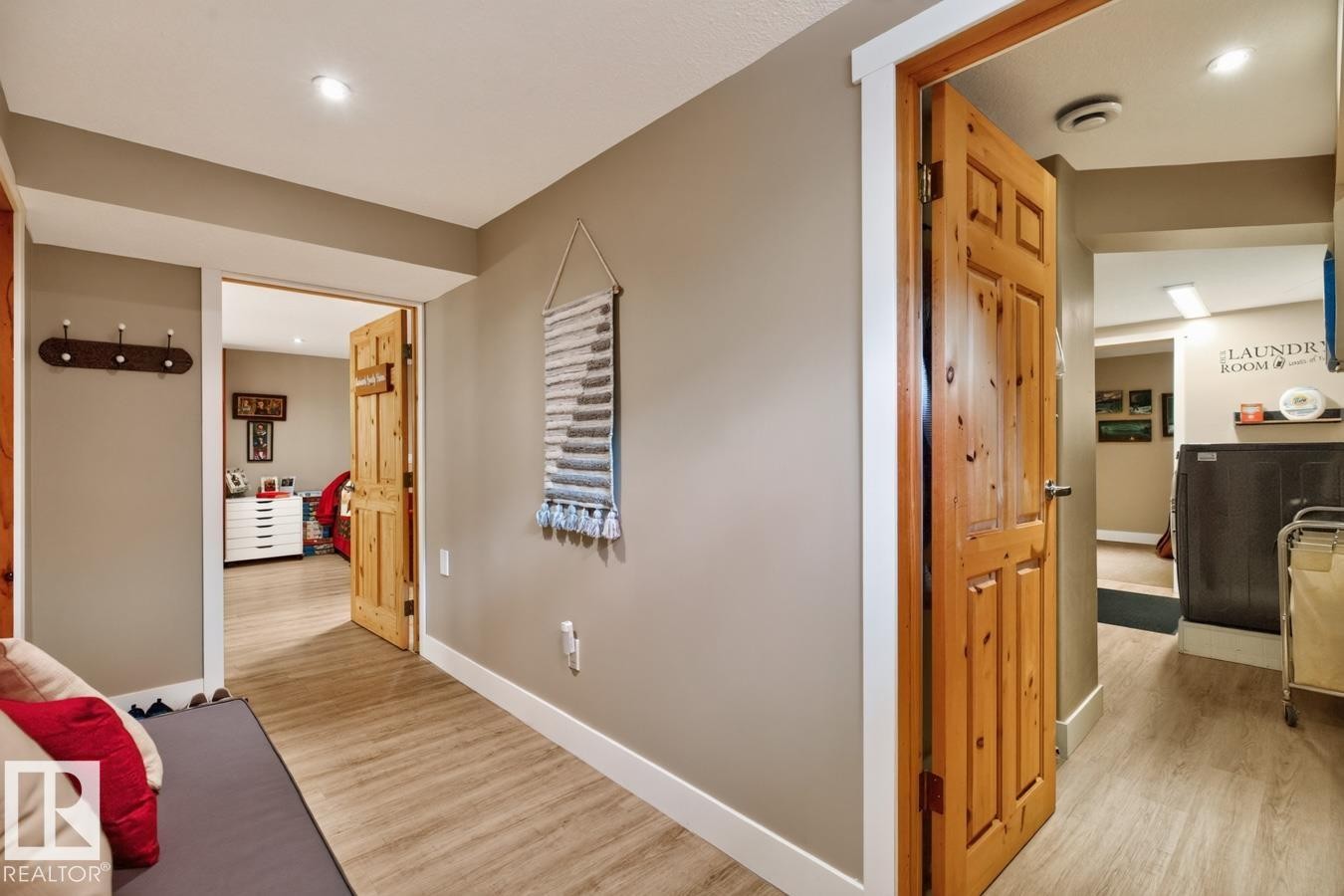 Hallway featuring wood-finish flooring, recessed lighting, and a solid wood door - 27 Milford Crescent, Sherwood Park, AB - Indoor