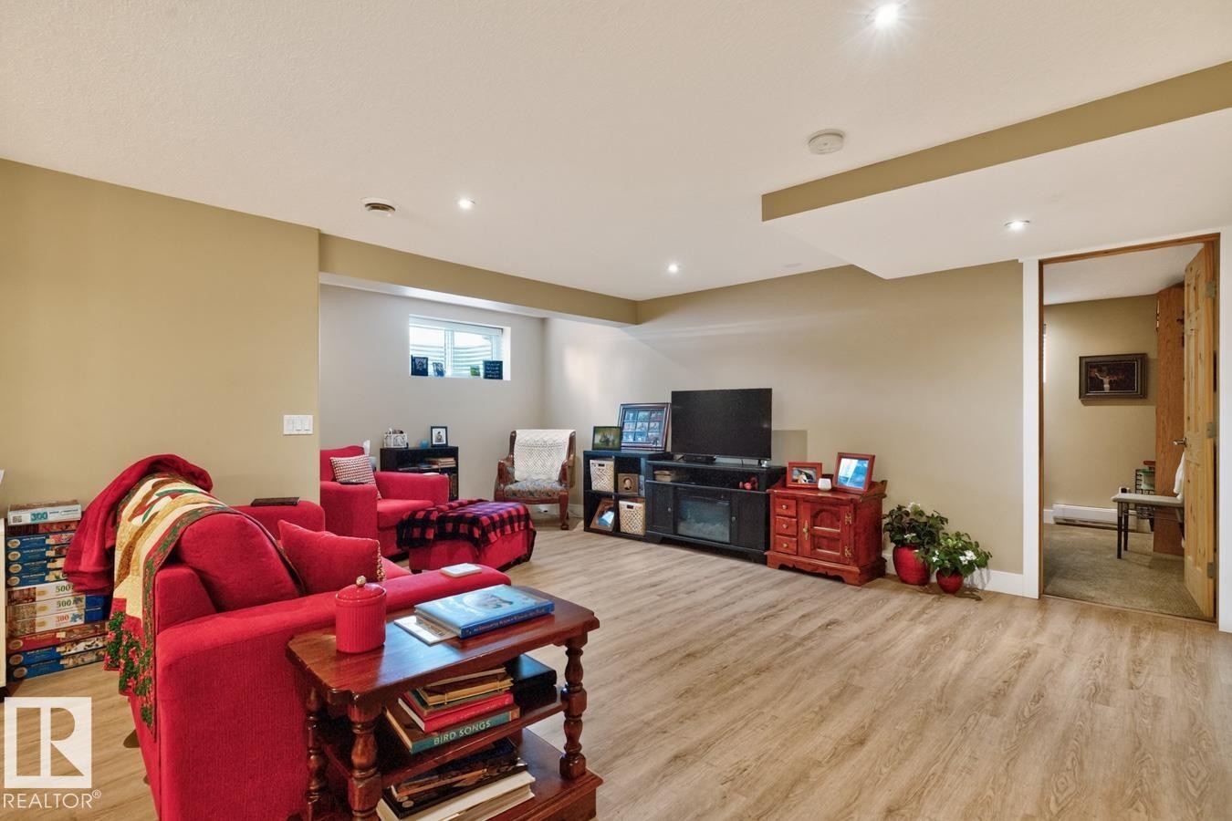 Finished lower level featuring wood-finish flooring, recessed lighting, and a window for natural light - 27 Milford Crescent, Sherwood Park, AB - Indoor