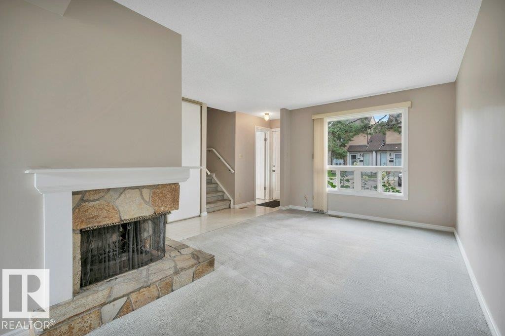 #22 1651 46 St Nw, Edmonton, AB - Indoor With Fireplace
