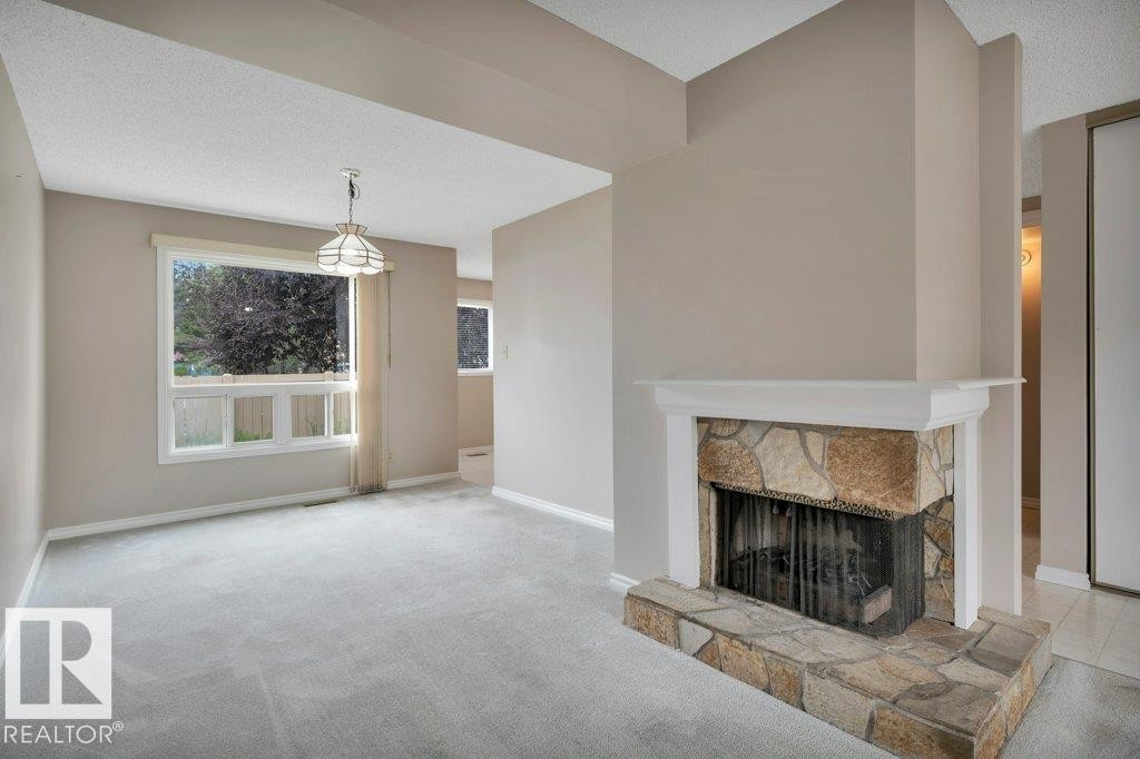 #22 1651 46 St Nw, Edmonton, AB - Indoor Photo Showing Living Room With Fireplace