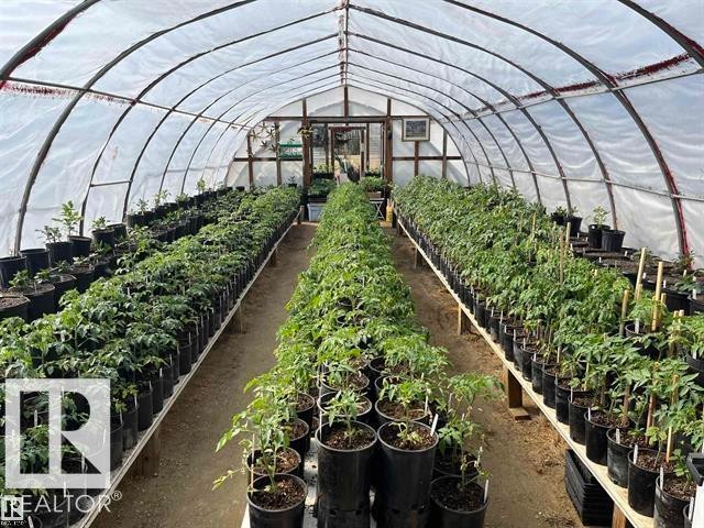 Hoop house structure featuring a translucent covering and a metal frame - 210 55504 Nikoodi Road, Rural Lac Ste. Anne County, AB -