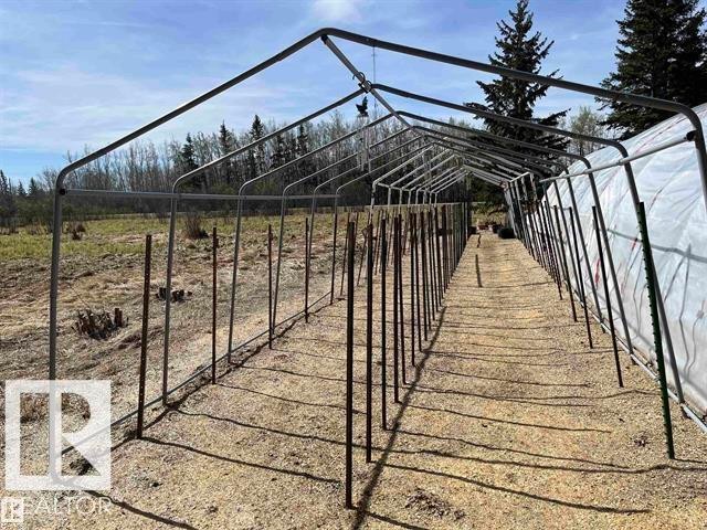 Metal frame structure featuring a partially covered exterior - 210 55504 Nikoodi Road, Rural Lac Ste. Anne County, AB - Outdoor