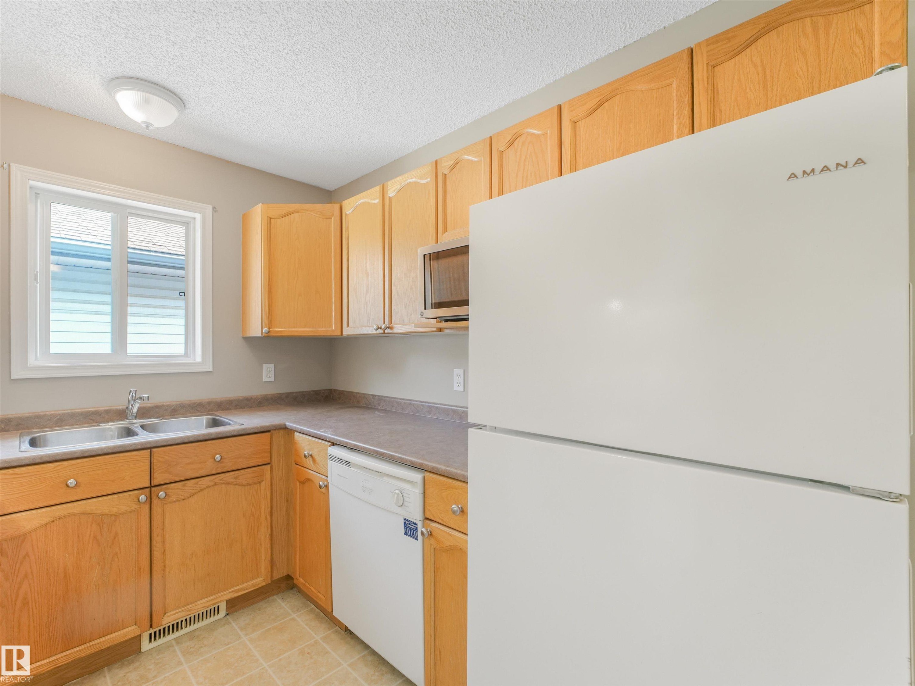 12027 105 Street Nw, Edmonton, AB - Indoor Photo Showing Kitchen With Double Sink