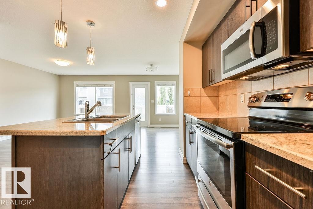 260 Sturtz Bend, Leduc, AB - Indoor Photo Showing Kitchen With Double Sink