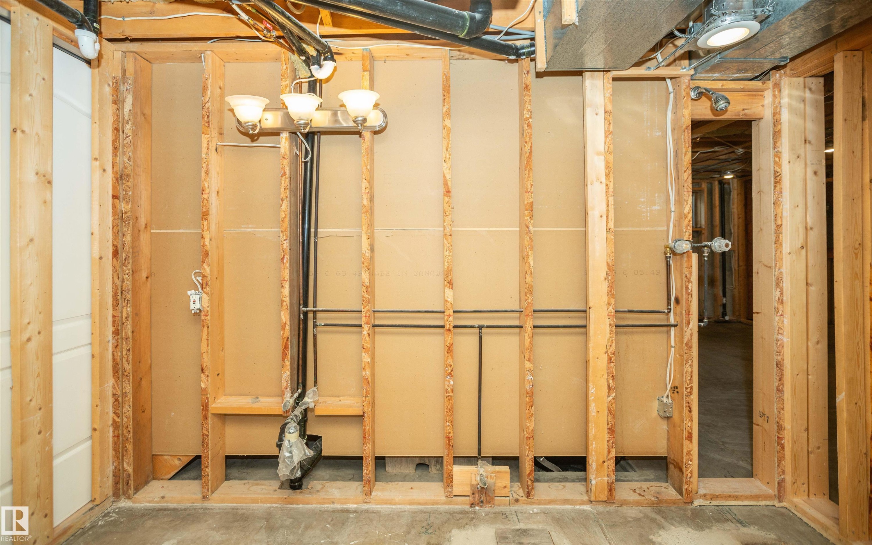 Framed interior space with exposed wooden studs - 5116 51 Avenue, Pickardville, AB - Indoor Photo Showing Basement
