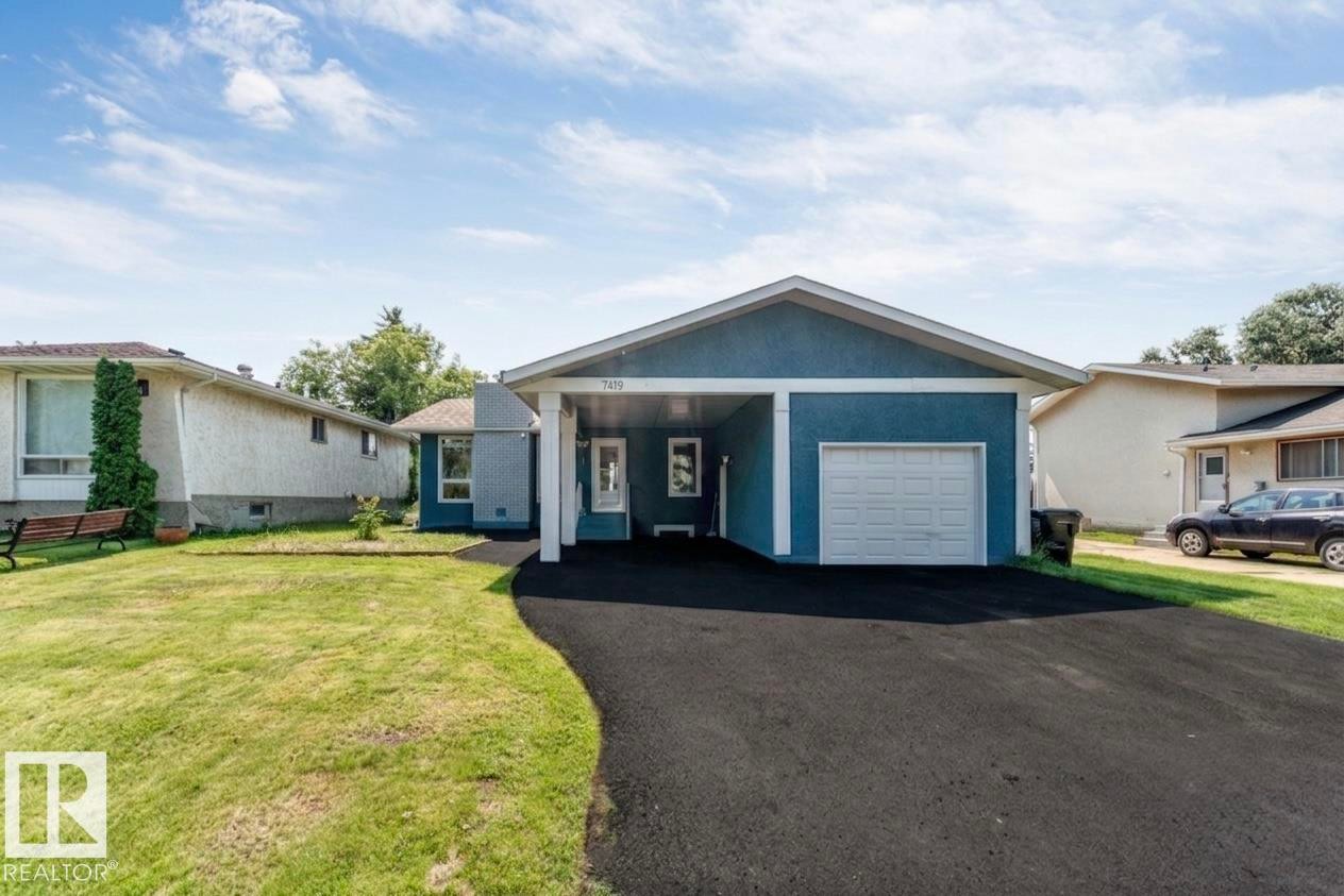 Ranch-style residence featuring a blue exterior finish and white trim - 7419 33 Avenue Nw, Edmonton, AB - Outdoor With Facade