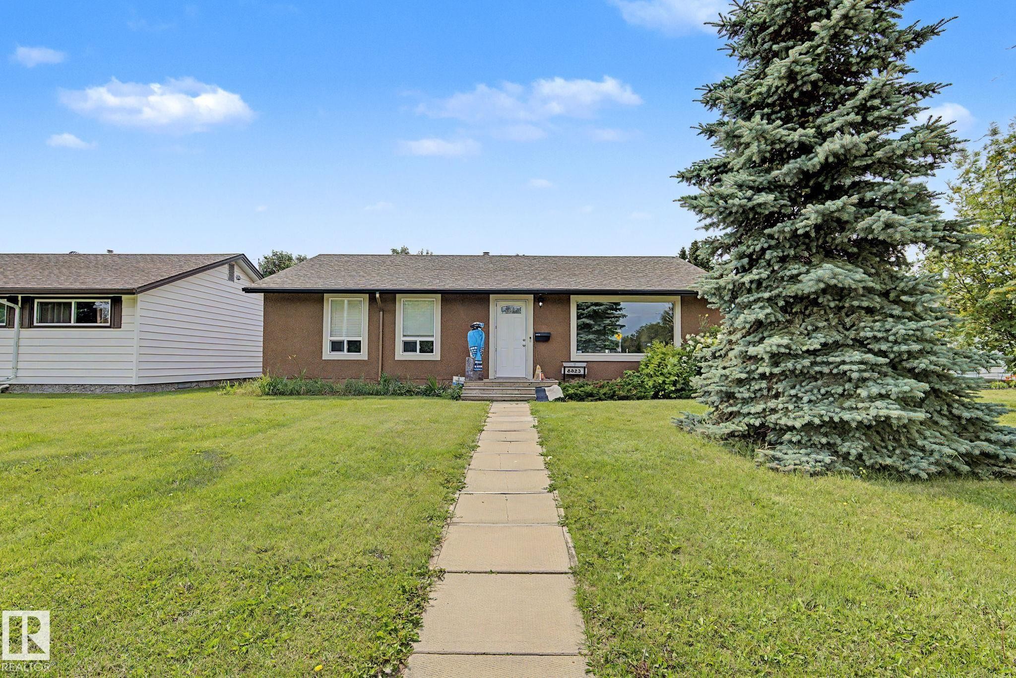 Ranch-style exterior with a brown stucco finish and a shingled roof - 8823 130A Avenue Nw, Edmonton, AB - Outdoor
