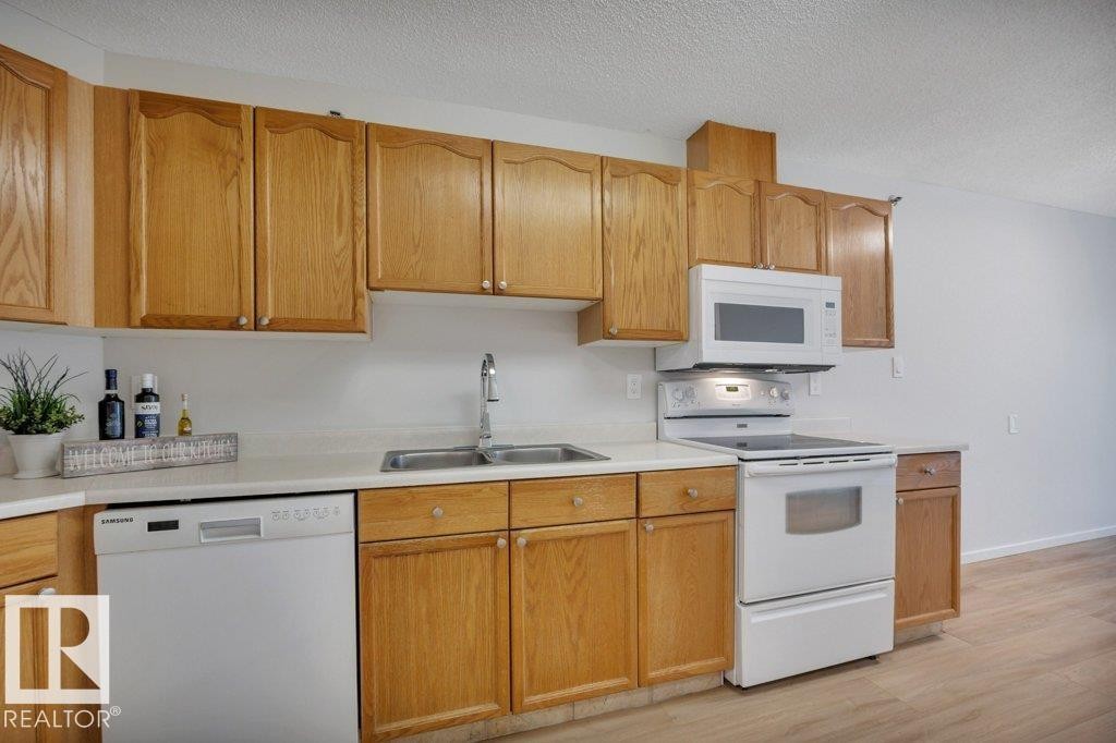#404E 17511 98A Av Nw, Edmonton, AB - Indoor Photo Showing Kitchen With Double Sink