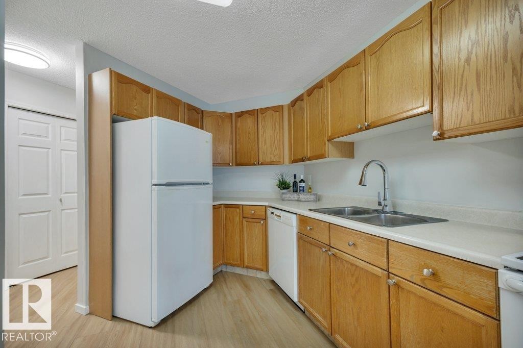 #404E 17511 98A Av Nw, Edmonton, AB - Indoor Photo Showing Kitchen With Double Sink