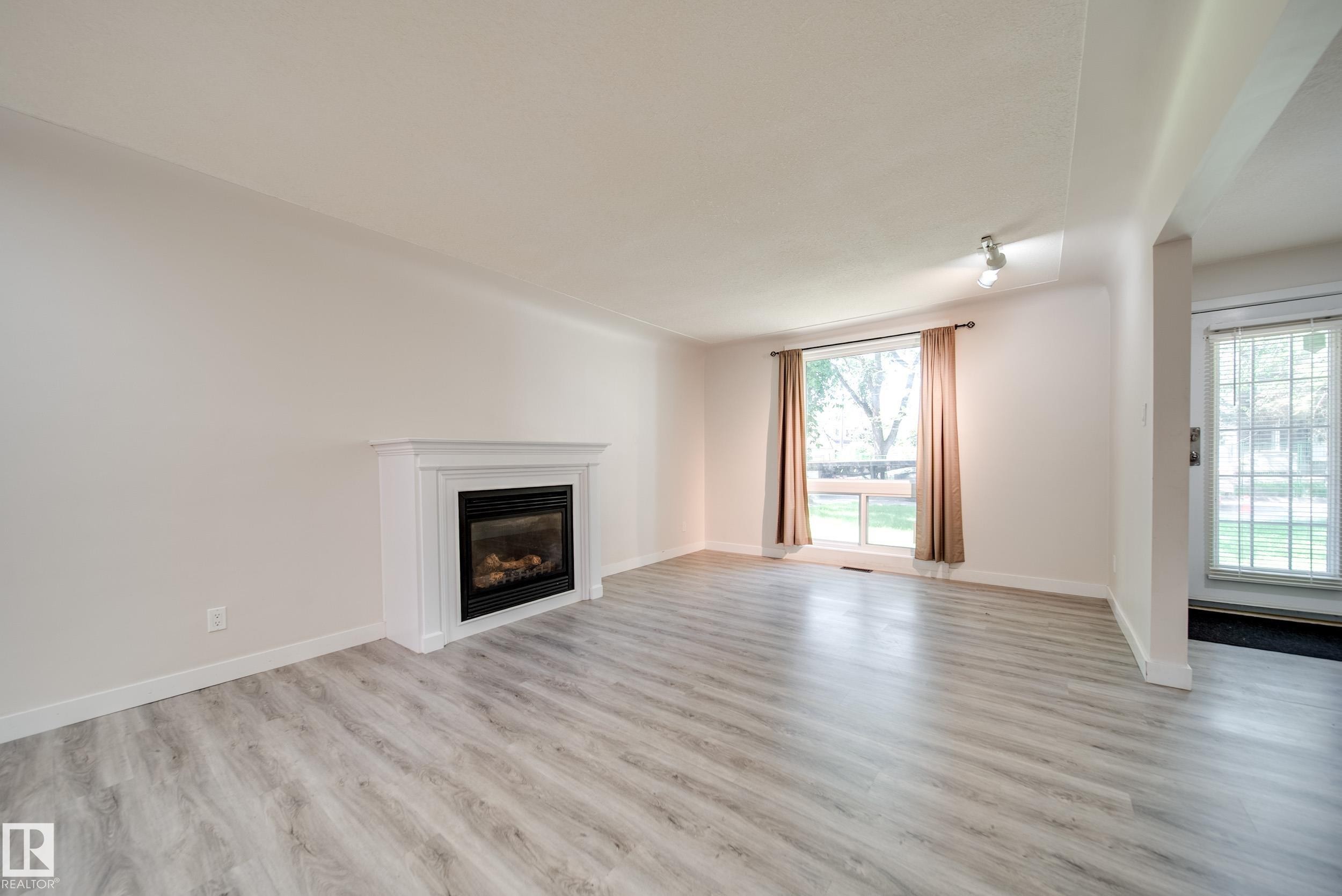 10519 140 Street Nw, Edmonton, AB - Indoor Photo Showing Living Room With Fireplace