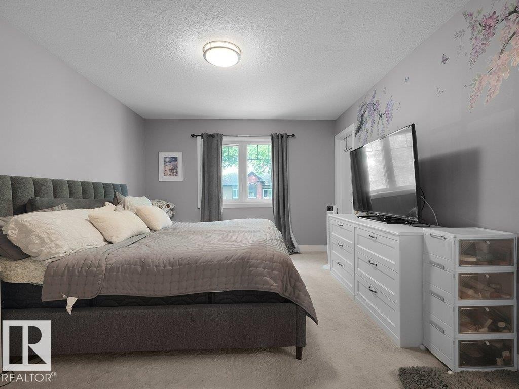 Carpeted room with a window, white trim, and light gray walls - 7909 105 Avenue Nw, Edmonton, AB - Indoor Photo Showing Bedroom