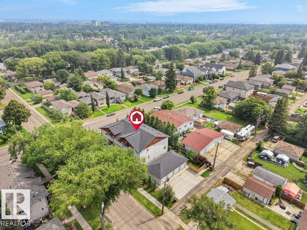 Aerial perspective of a multi-story property with a dark shingle roof - 7909 105 Avenue Nw, Edmonton, AB - Outdoor With View