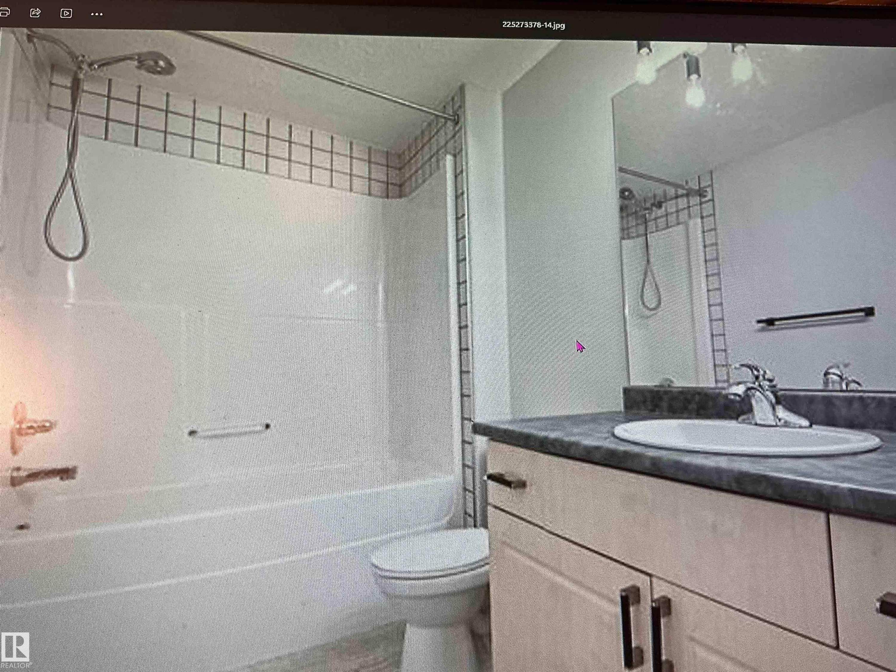 Bathroom featuring a white tub, shower with a tiled surround, toilet, vanity with a countertop, and an integrated sink with a chrome faucet - #106 592 Hooke Rd Nw, Edmonton, AB