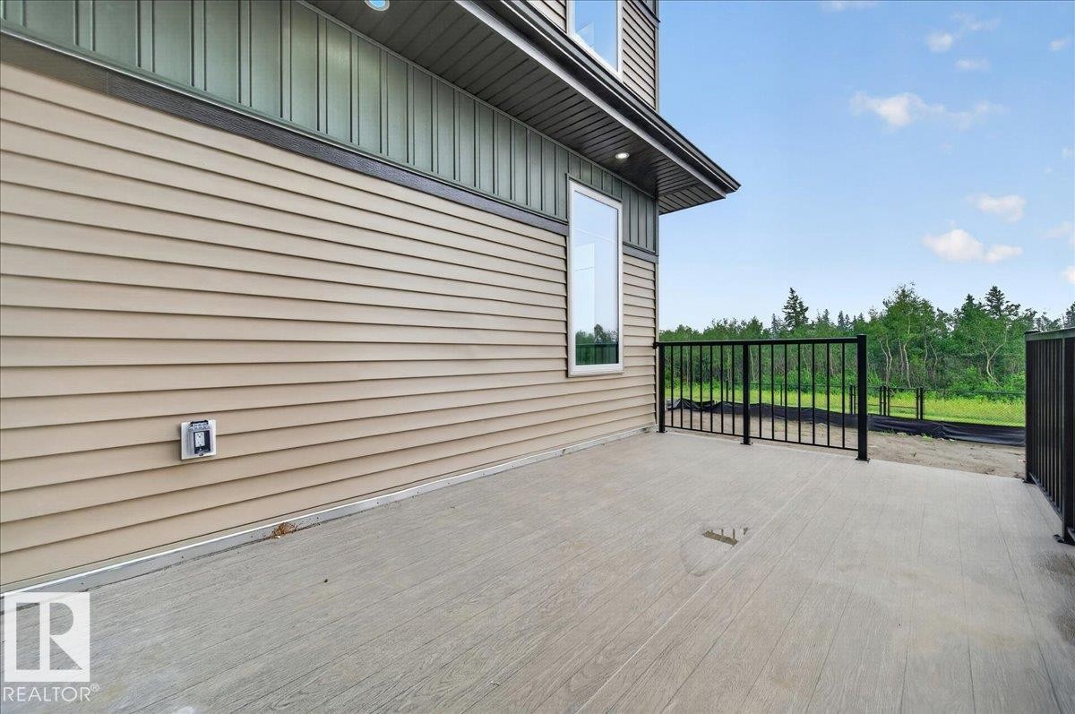 Expansive outdoor deck space with durable composite decking and black metal railings - 403 172 Avenue Nw, Edmonton, AB - Outdoor With Exterior