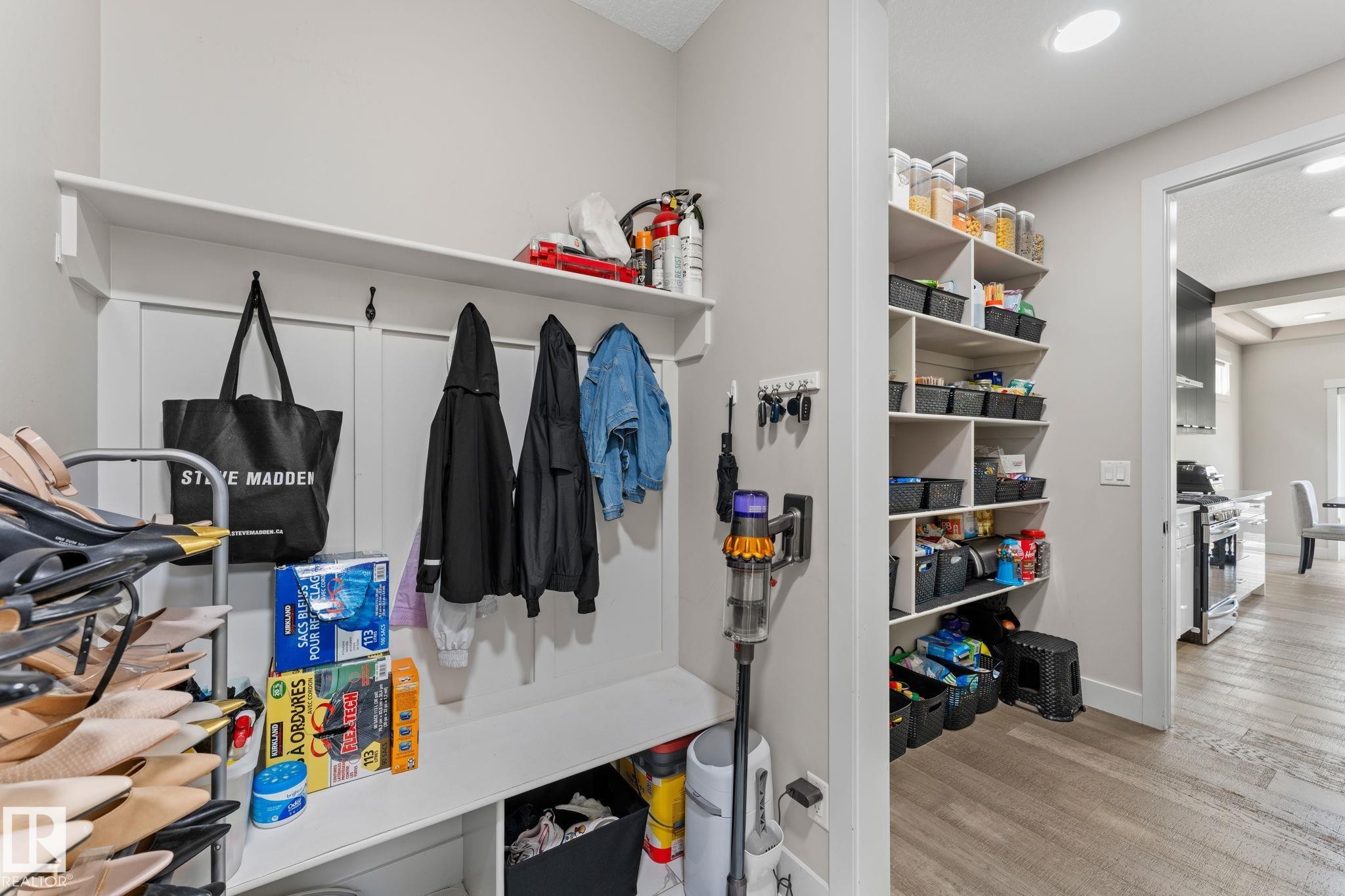 Entryway mudroom featuring built-in storage bench, upper shelving, and coat hooks - 12383 176 Avenue Nw, Edmonton, AB - Indoor Photo Showing Other Room