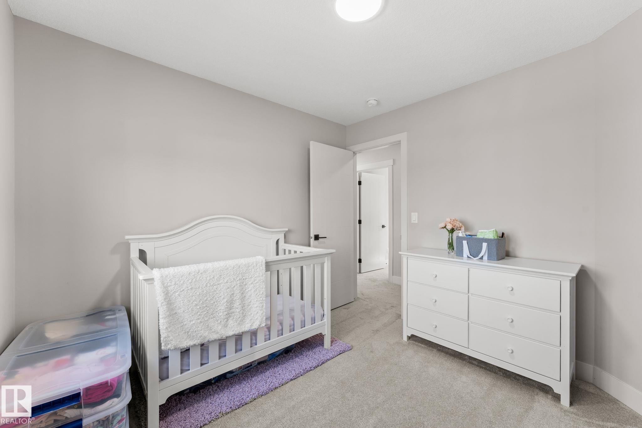 Neutral-toned room featuring light gray walls and plush gray carpeting - 12383 176 Avenue Nw, Edmonton, AB - Indoor