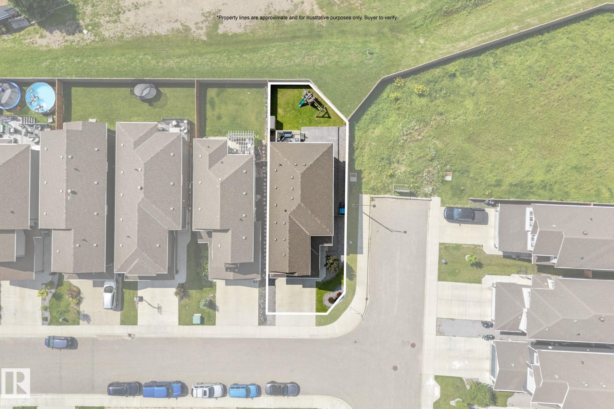 Aerial view showcasing a corner property with an expansive backyard featuring a green lawn and a small play structure - 12383 176 Avenue Nw, Edmonton, AB - Outdoor With View
