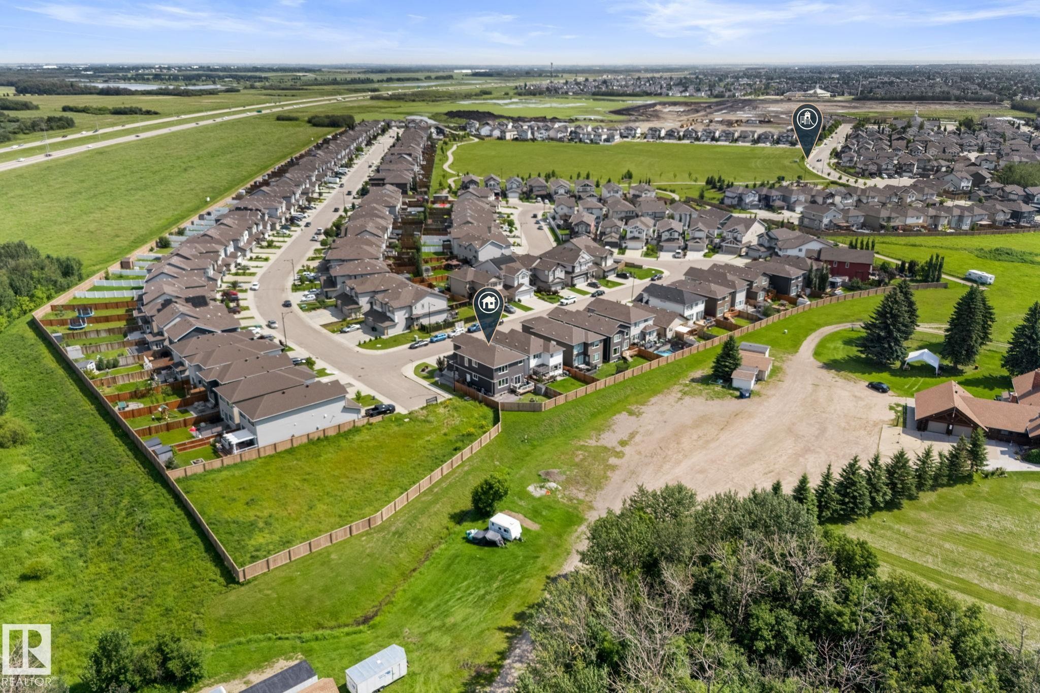 Aerial perspective showcasing a residential development with numerous detached homes - 12383 176 Avenue Nw, Edmonton, AB - Outdoor With View