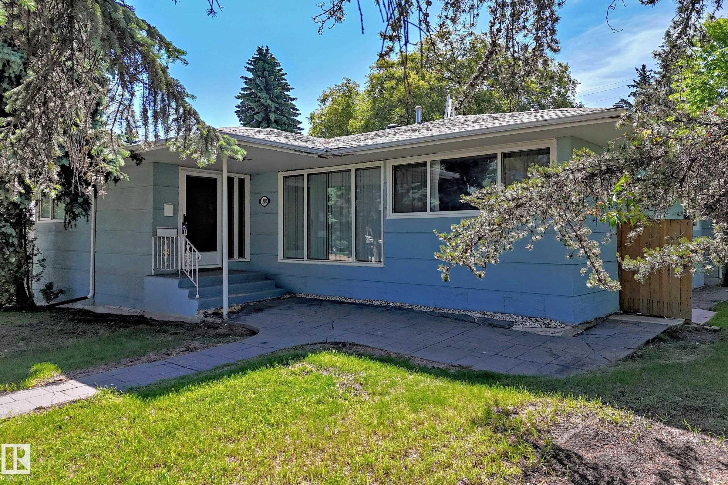 Single-story residence featuring light blue siding and a light-colored shingle roof - 12011 87 Avenue Nw, Edmonton, AB - Outdoor