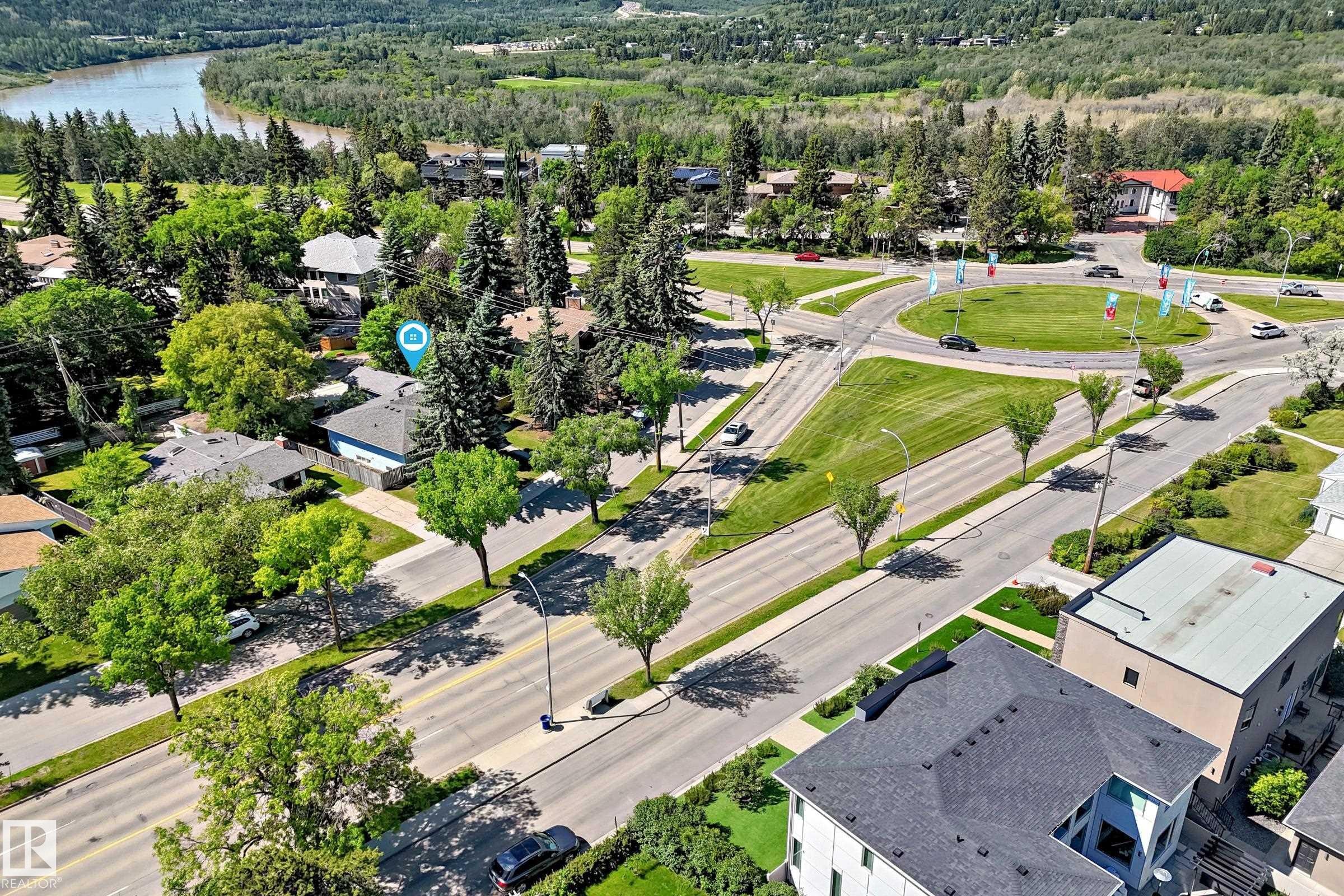 Aerial view showcasing a residential area with varied rooflines and extensive tree coverage - 12011 87 Avenue Nw, Edmonton, AB - Outdoor With View
