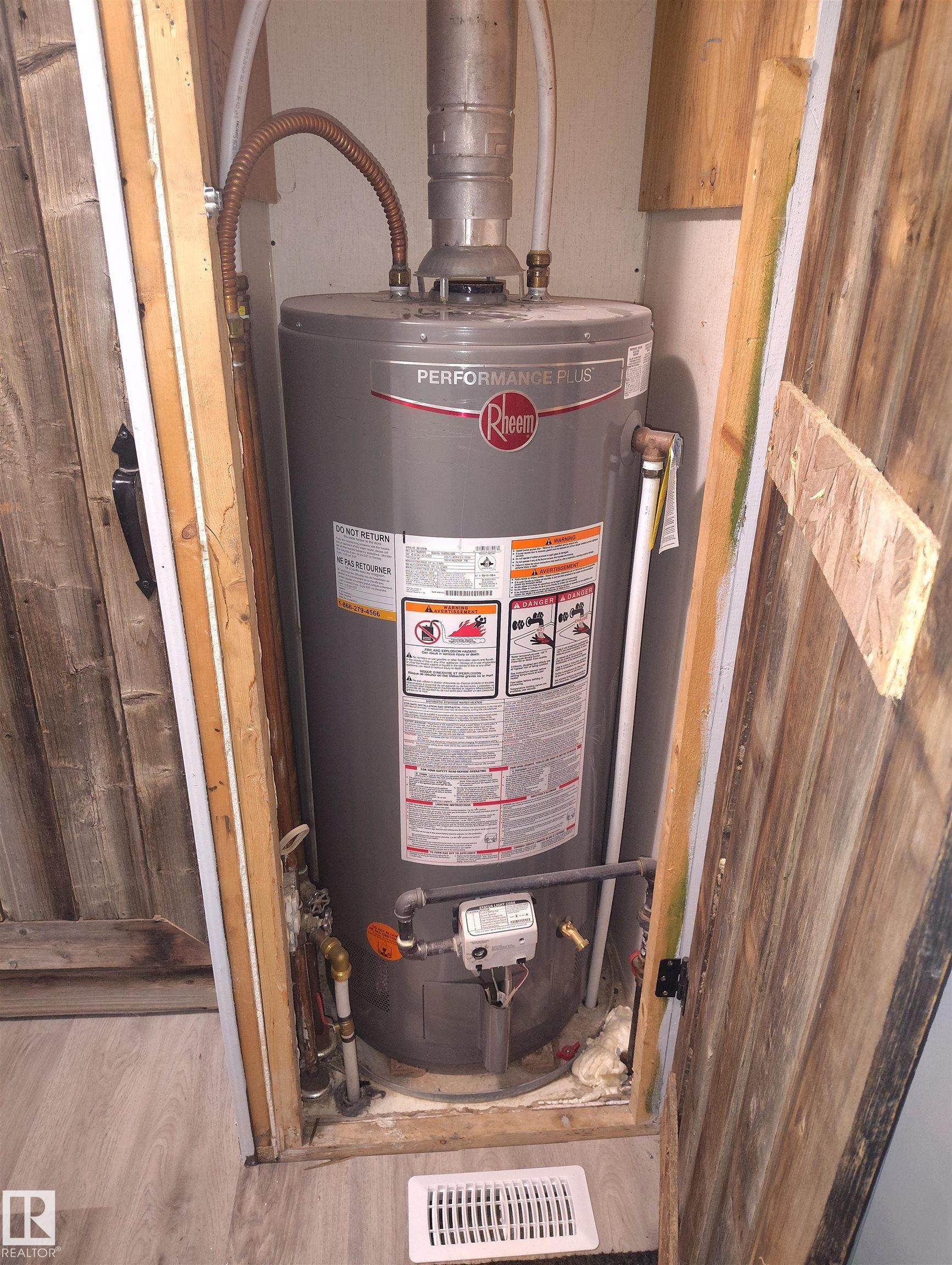 Rheem Performance Plus water heater installation - 42 Midland Road, Millet, AB - Indoor Photo Showing Basement