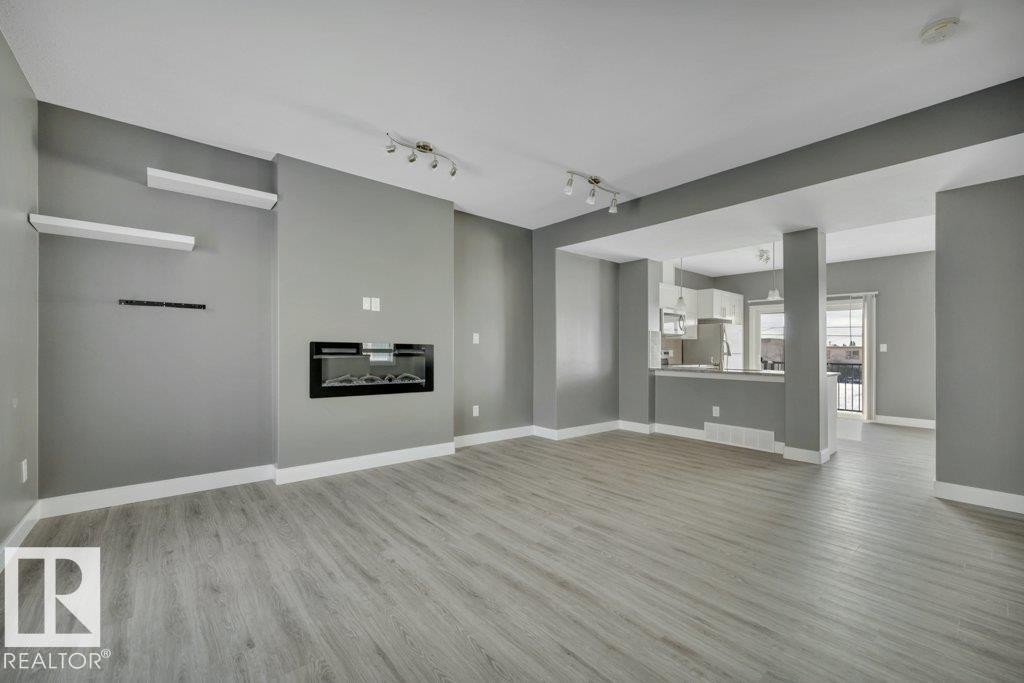 #13 13003 132 Av Nw, Edmonton, AB - Indoor With Fireplace
