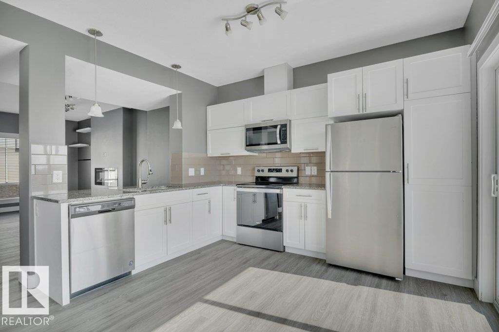 #13 13003 132 Av Nw, Edmonton, AB - Indoor Photo Showing Kitchen With Stainless Steel Kitchen