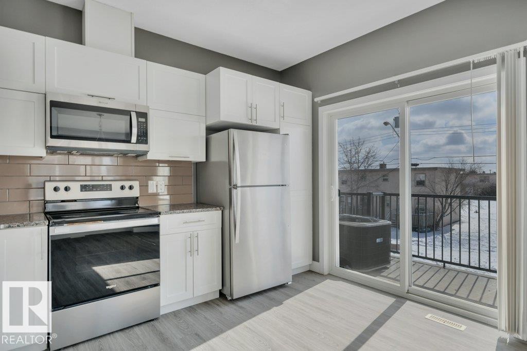 #13 13003 132 Av Nw, Edmonton, AB - Indoor Photo Showing Kitchen With Stainless Steel Kitchen