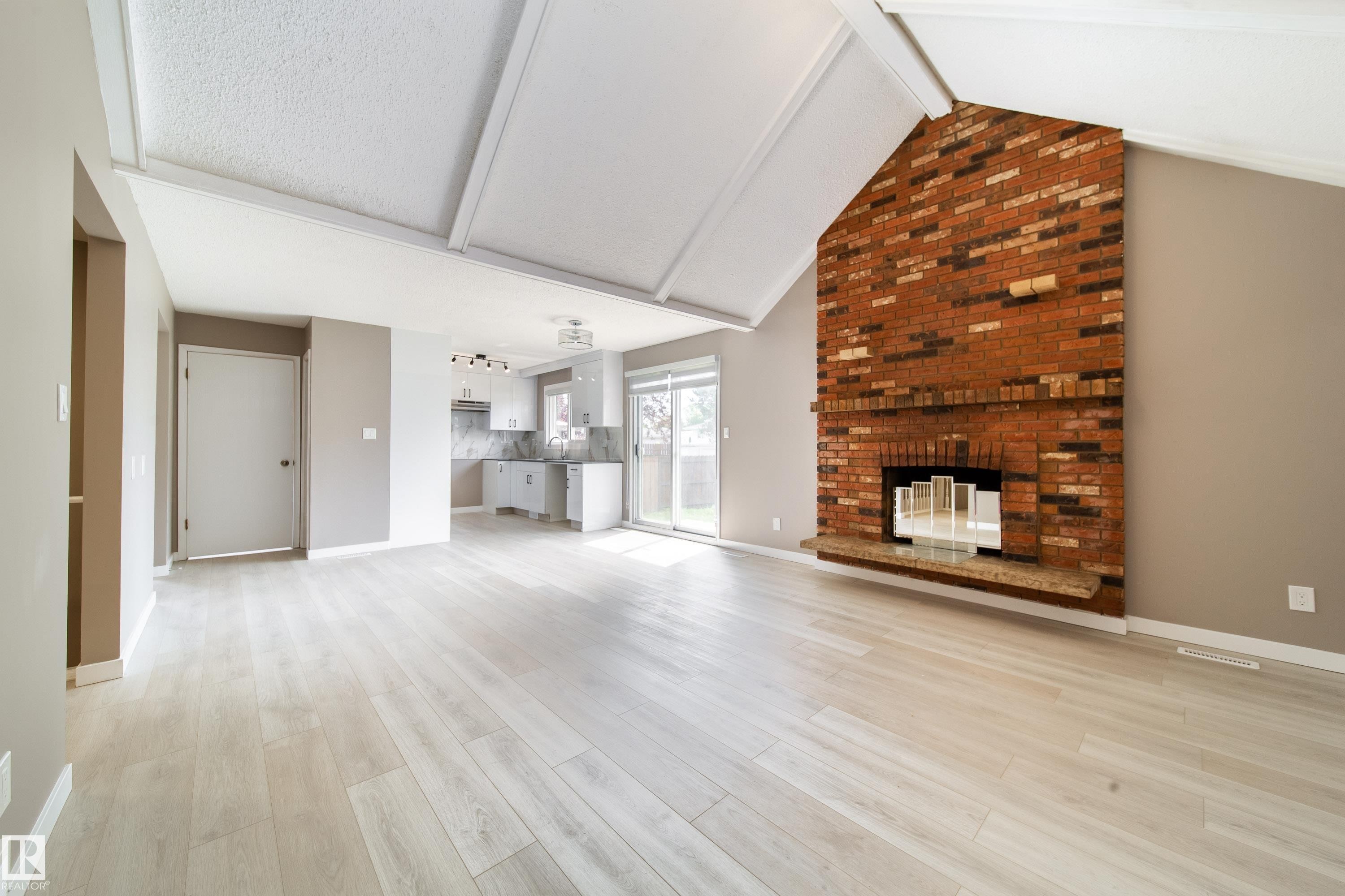 6907 19 Avenue Nw, Edmonton, AB - Indoor Photo Showing Living Room With Fireplace