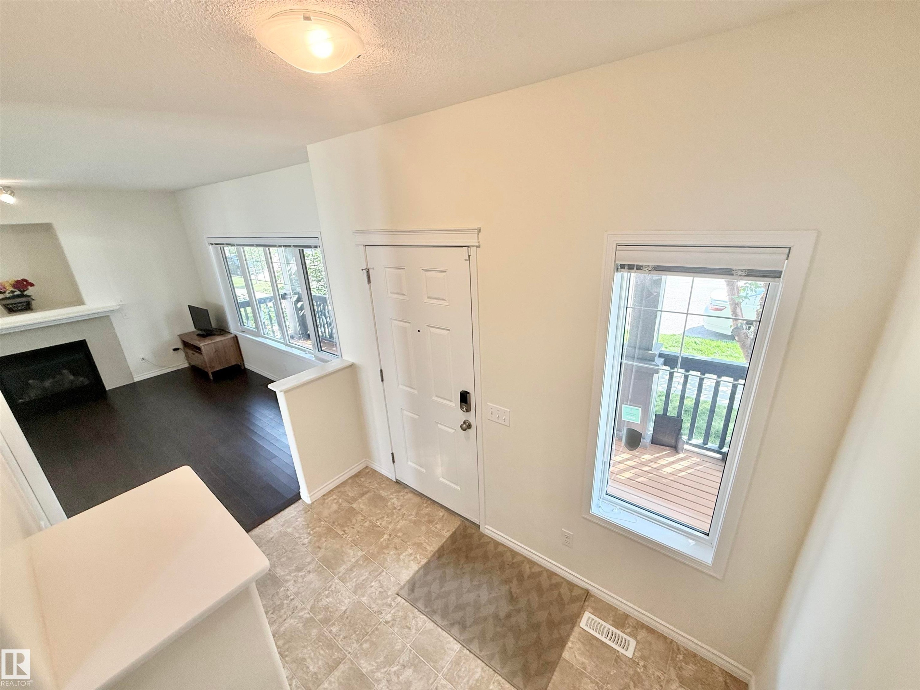 7622 Schmid Crescent Nw, Edmonton, AB - Indoor Photo Showing Other Room With Fireplace