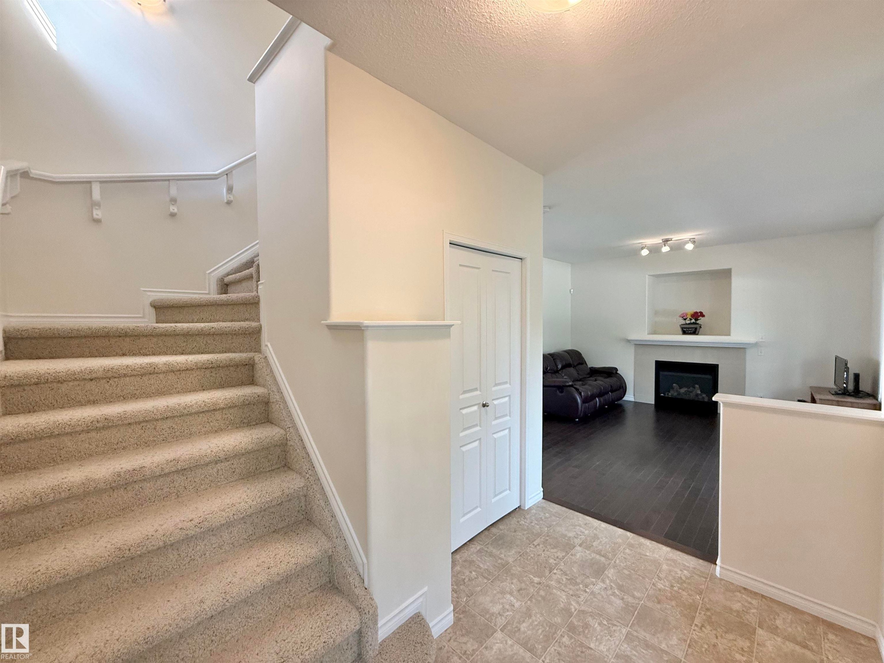 7622 Schmid Crescent Nw, Edmonton, AB - Indoor Photo Showing Other Room With Fireplace