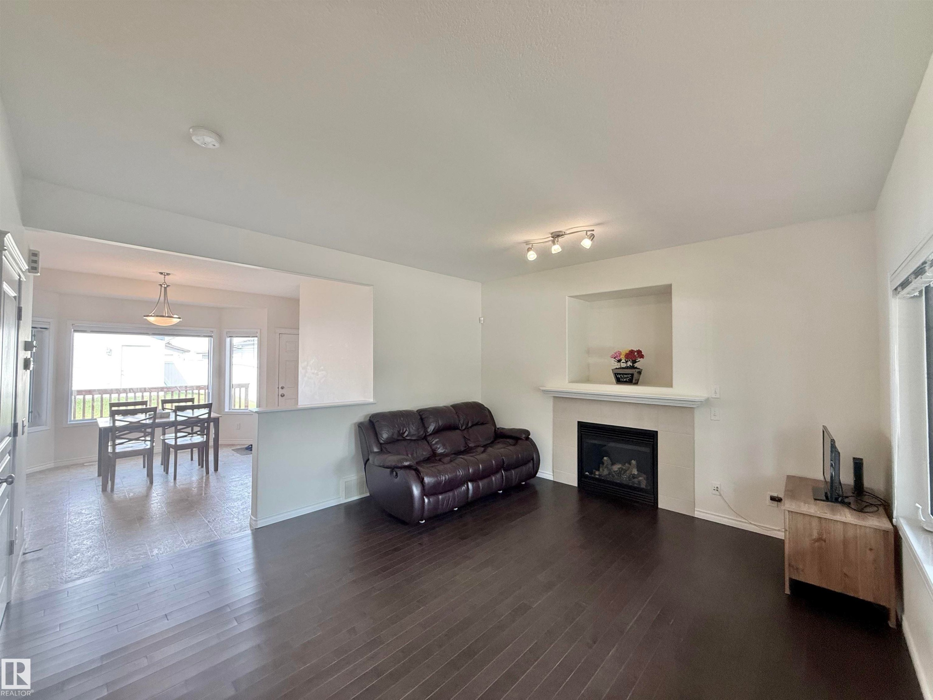 7622 Schmid Crescent Nw, Edmonton, AB - Indoor Photo Showing Living Room With Fireplace