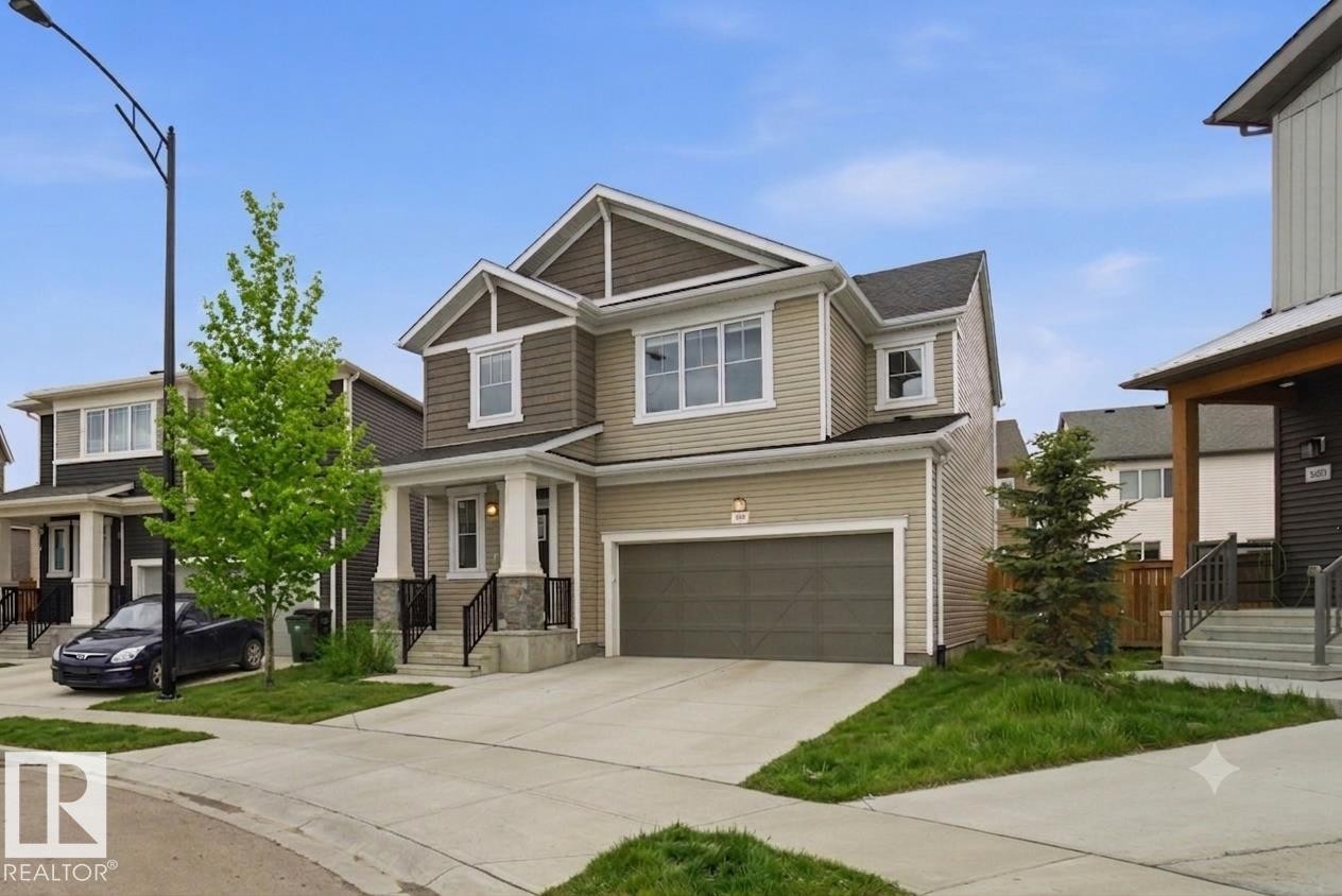 Two-story residence featuring a combination of horizontal siding and shake siding - 1607 202 Street Nw, Edmonton, AB - Outdoor With Facade