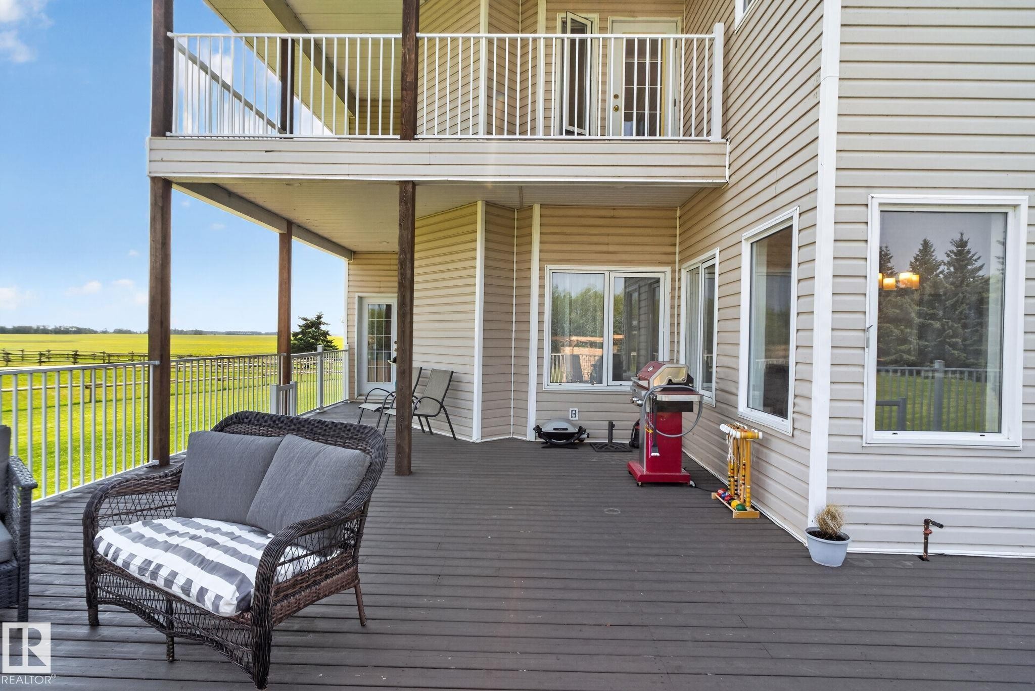 Multi-level deck and balcony with vinyl siding exterior - 50336 Range Road 280, Rural Leduc County, AB - Outdoor With Exterior