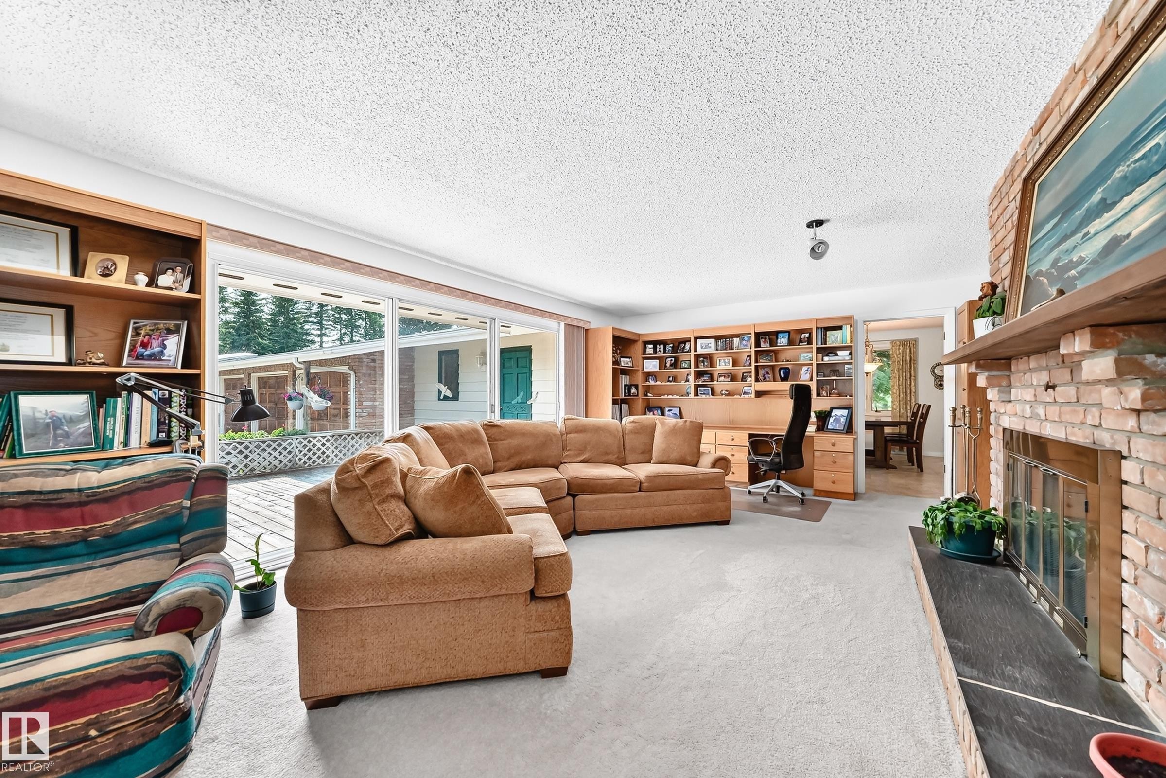 #24 25507 Twp Road 512 A, Rural Parkland County, AB - Indoor Photo Showing Living Room With Fireplace