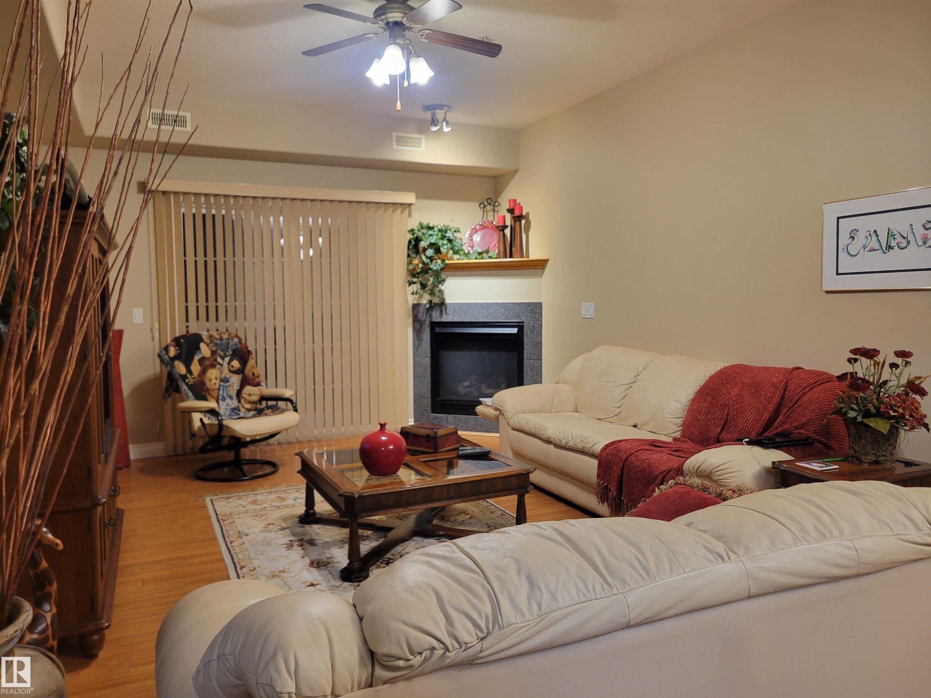 #106 4128 47 St, Drayton Valley, AB - Indoor Photo Showing Living Room With Fireplace