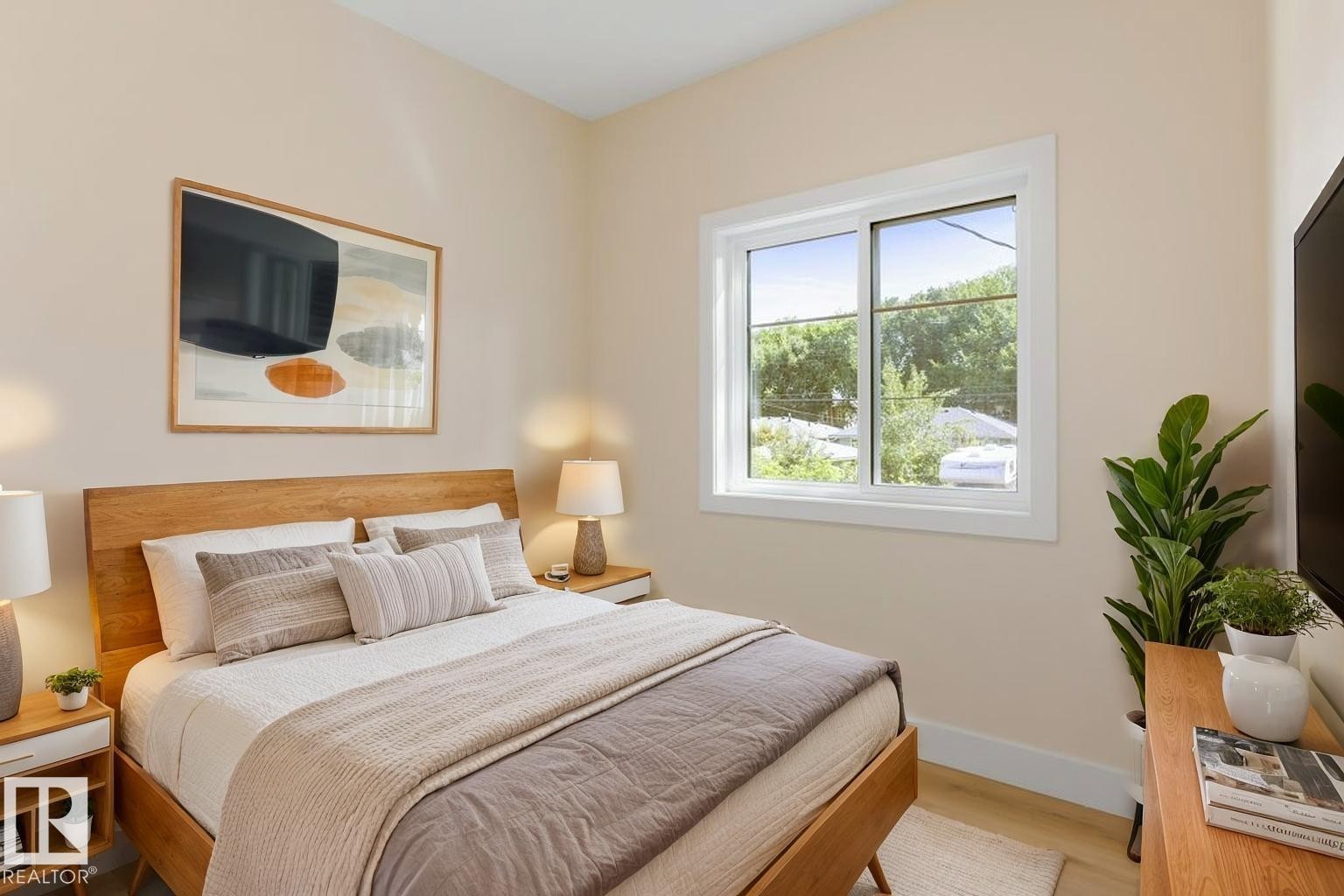 Bedroom featuring a natural wood-finish bed frame and coordinating nightstands with integrated drawers - 10323 79 Street Nw, Edmonton, AB - Indoor Photo Showing Bedroom