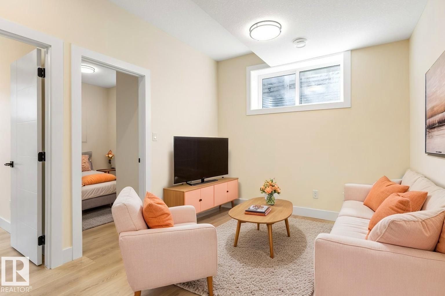 Living area featuring recessed lighting, a horizontal sliding window, and wood-finish flooring - 10323 79 Street Nw, Edmonton, AB - Indoor Photo Showing Living Room