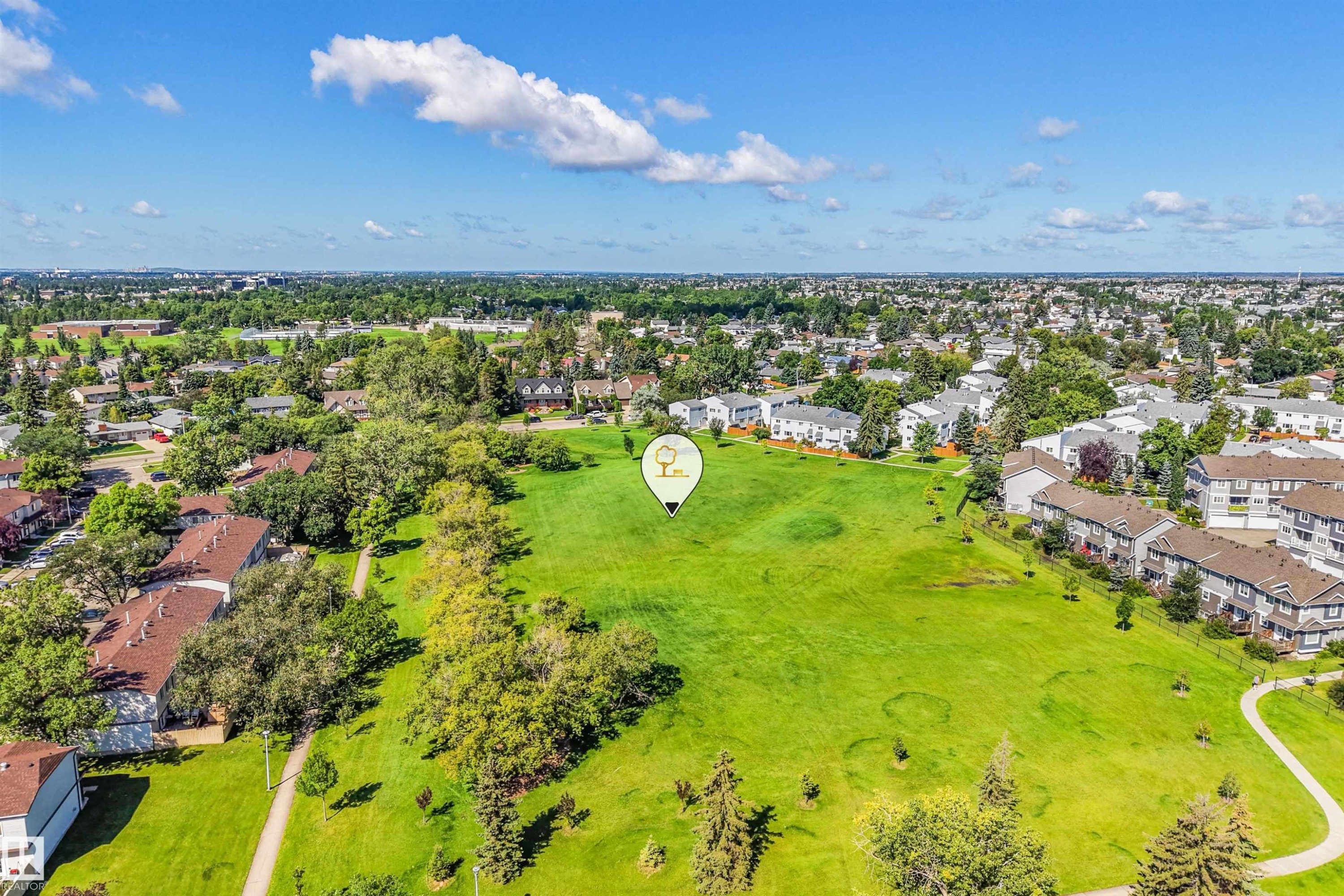 Expansive green space featuring mature trees and paved walking paths - #39 14511 52 Street Nw, Edmonton, AB - Outdoor With View
