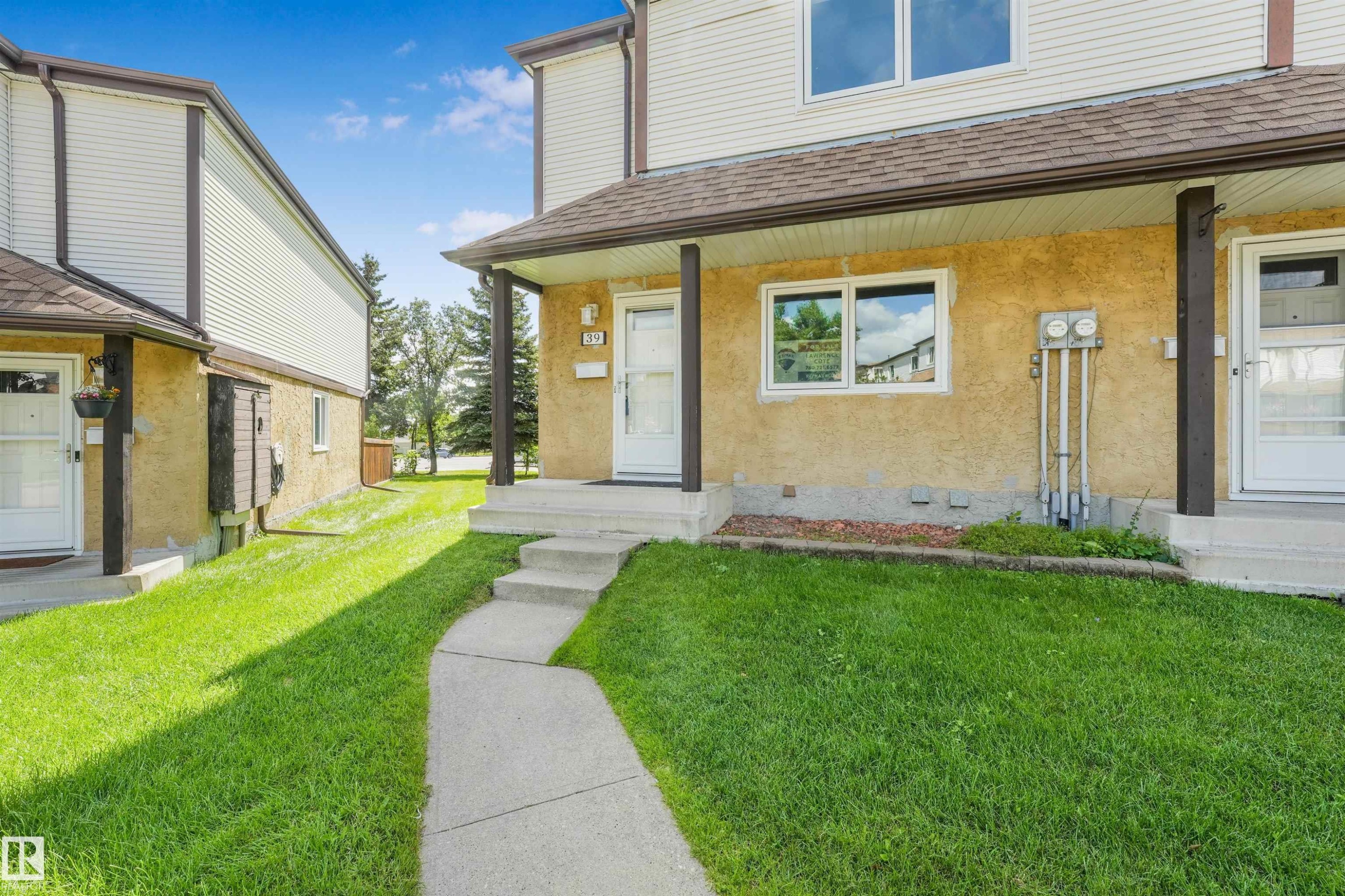 Concrete walkway leading to a covered entry with concrete steps - #39 14511 52 Street Nw, Edmonton, AB - Outdoor With Exterior