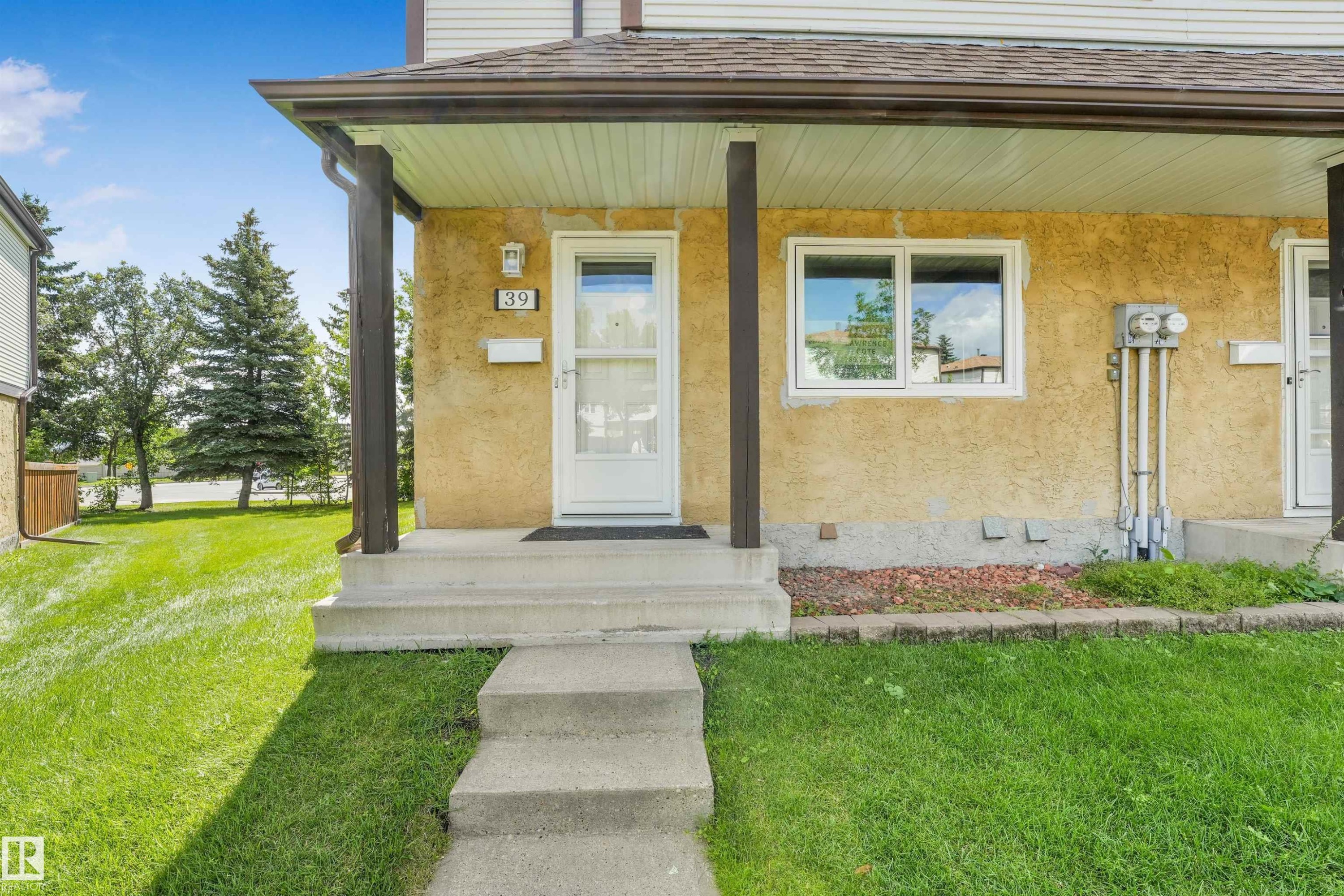 Front entry featuring a concrete walkway and steps - #39 14511 52 Street Nw, Edmonton, AB - Outdoor