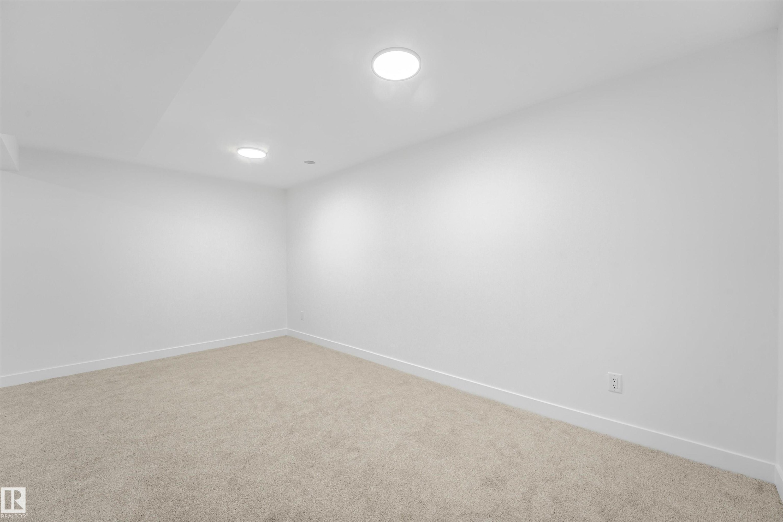 Carpeted room featuring recessed lighting, white walls, and white baseboards - #39 14511 52 Street Nw, Edmonton, AB - Indoor Photo Showing Other Room
