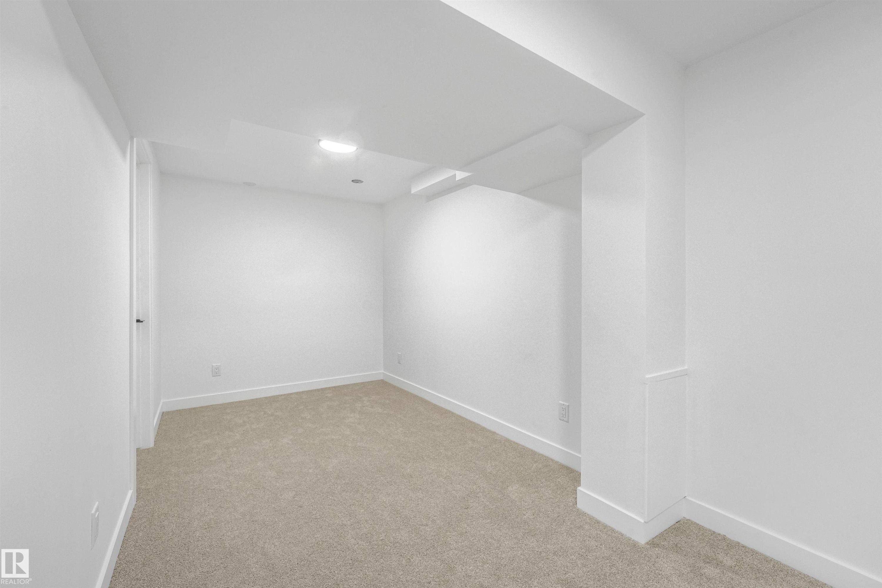 Carpeted interior space with crisp white walls and ceiling - #39 14511 52 Street Nw, Edmonton, AB - Indoor Photo Showing Other Room