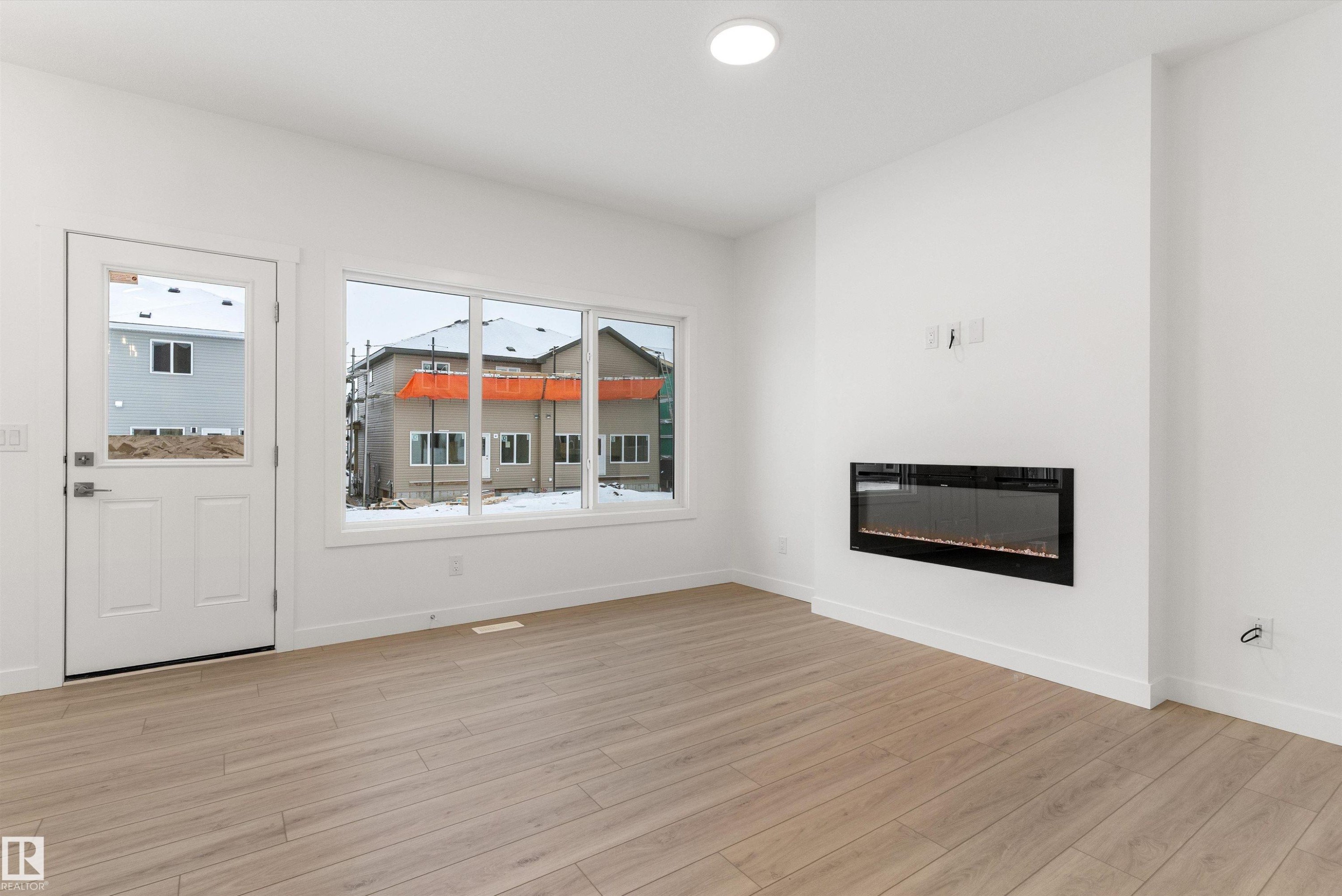 913 19 Avenue Nw, Edmonton, AB - Indoor Photo Showing Other Room With Fireplace
