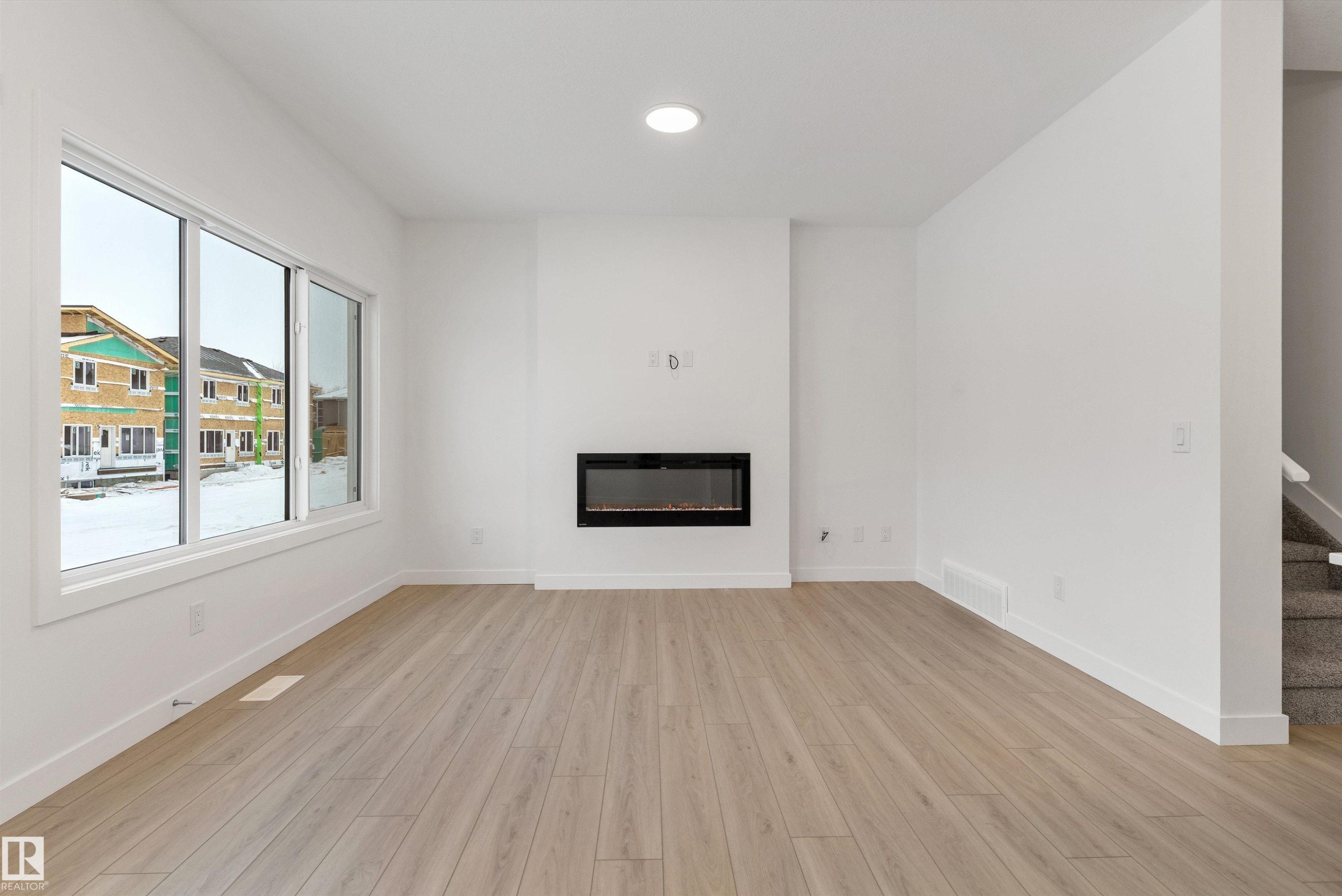 913 19 Avenue Nw, Edmonton, AB - Indoor Photo Showing Other Room With Fireplace